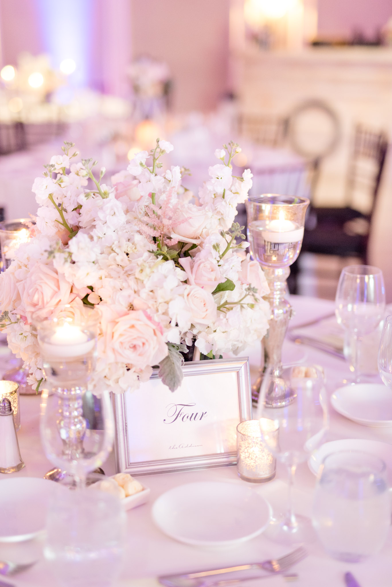 Florals on reception tables.