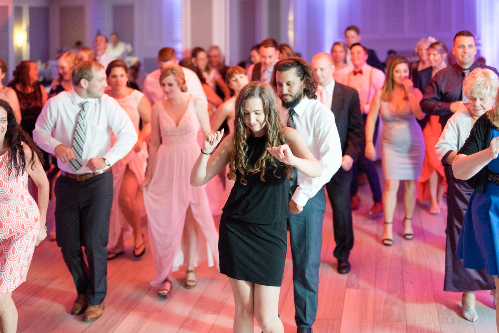 Wedding guests dance.