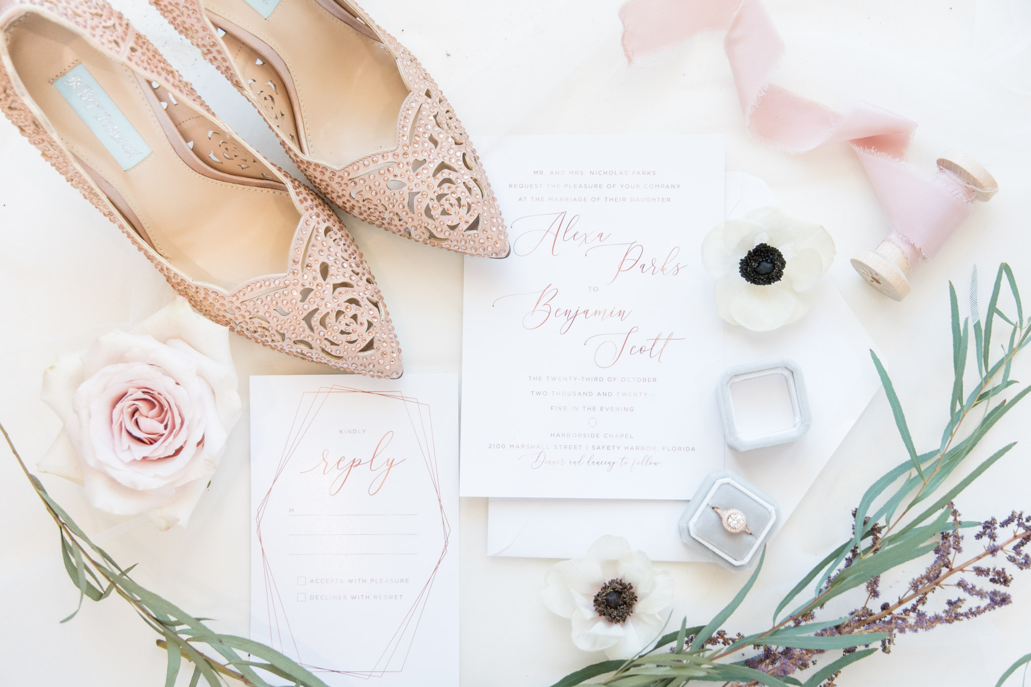 Bride's wedding invitations and details.