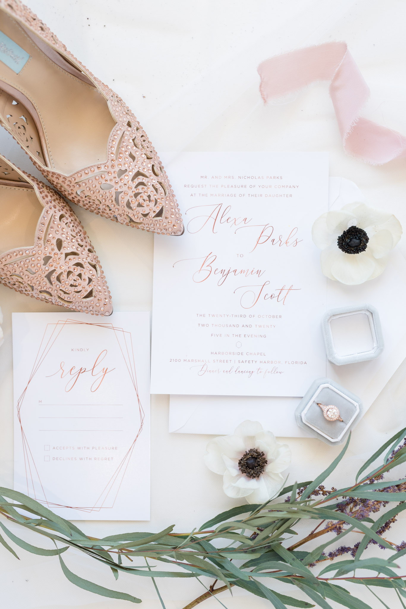 Bride's details and wedding invitations.