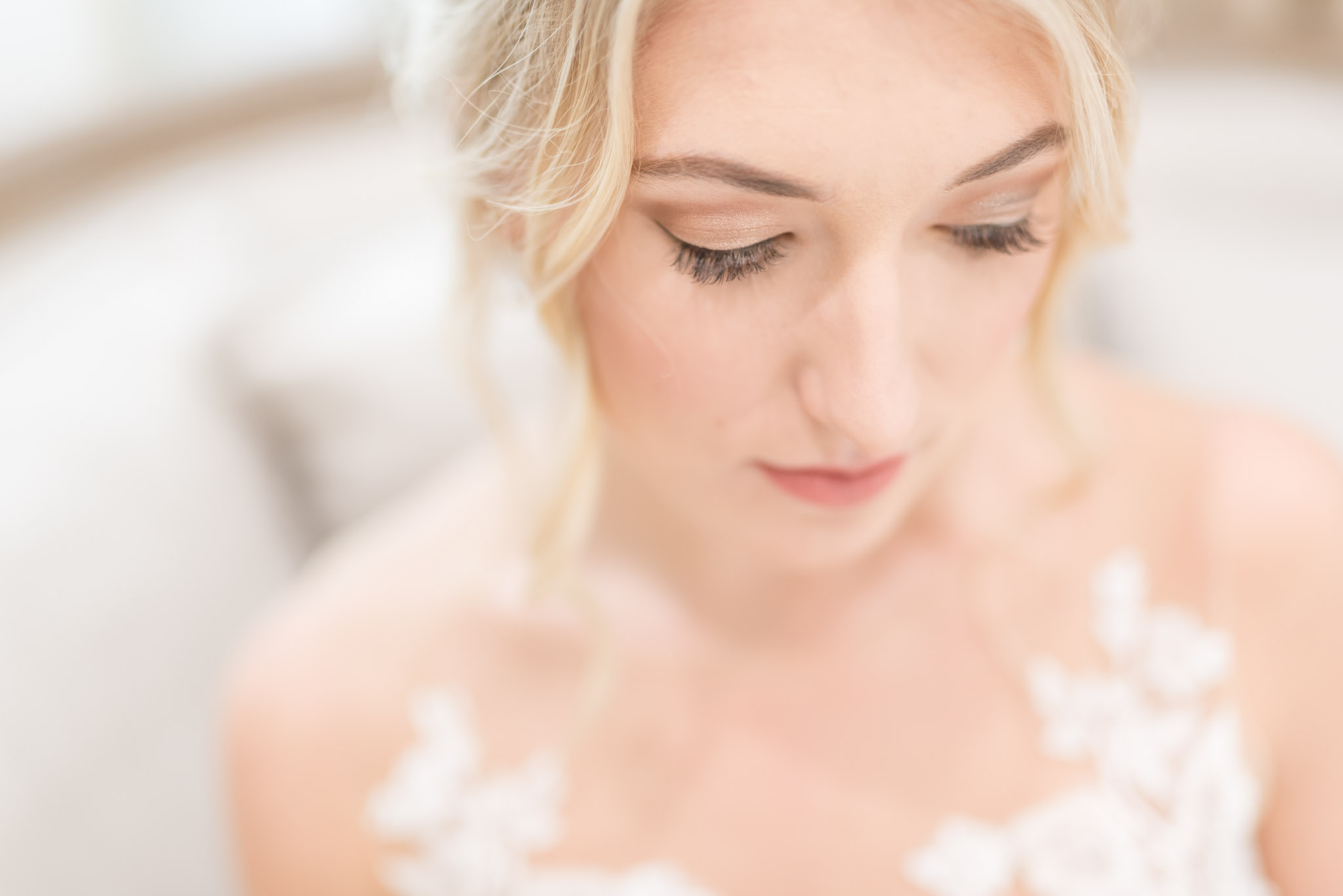 Bride looks down for close up image.