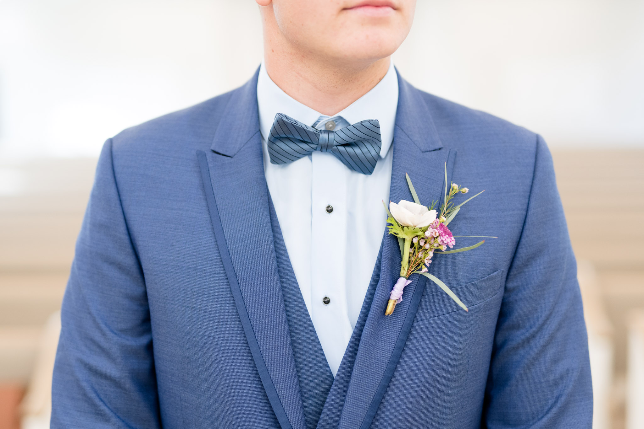 Groom's bow tie and boutonniere.