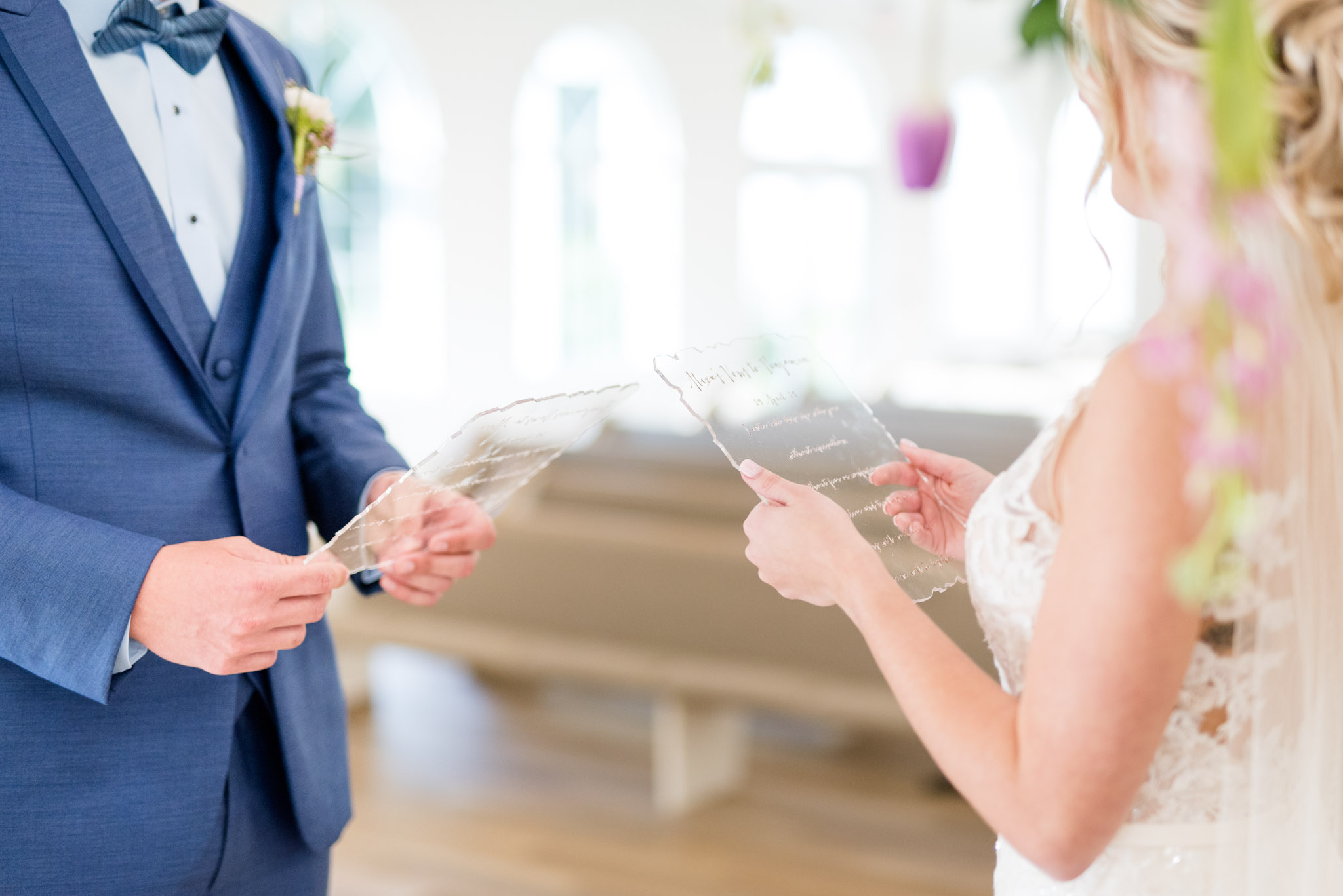 Bride reads vows to groom.