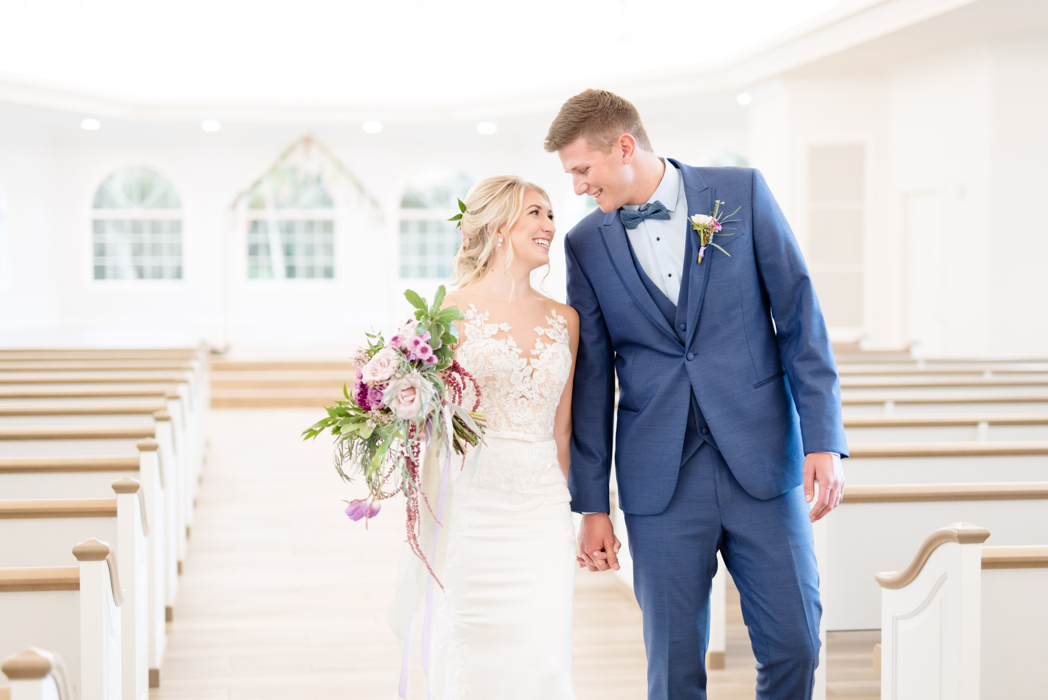 Bride and groom walk down aisle.