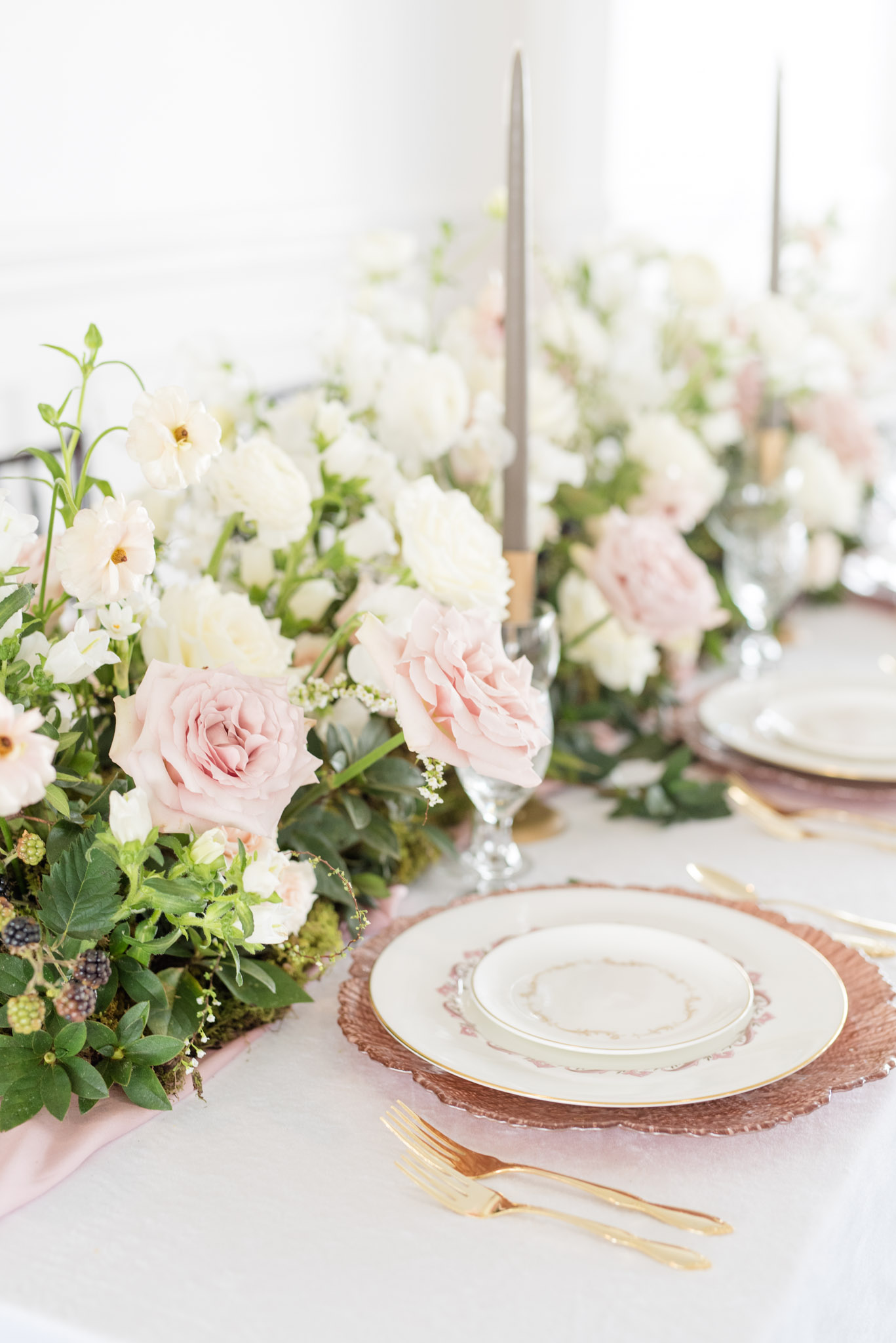 Blush flowers on reception tables.
