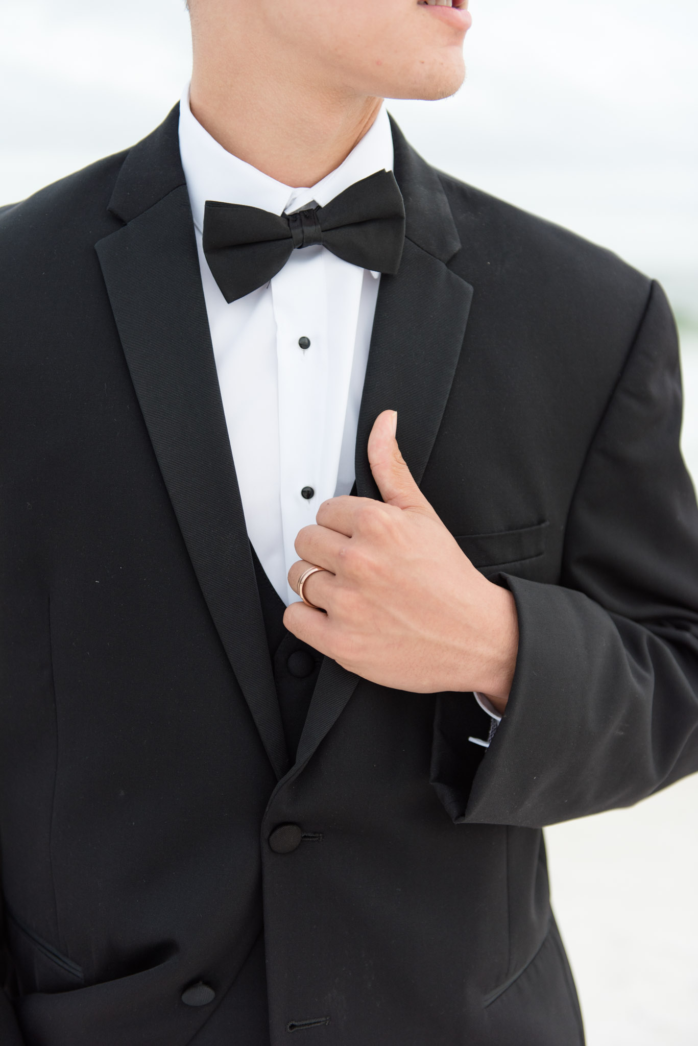 Closeup of groom's tuxedo.