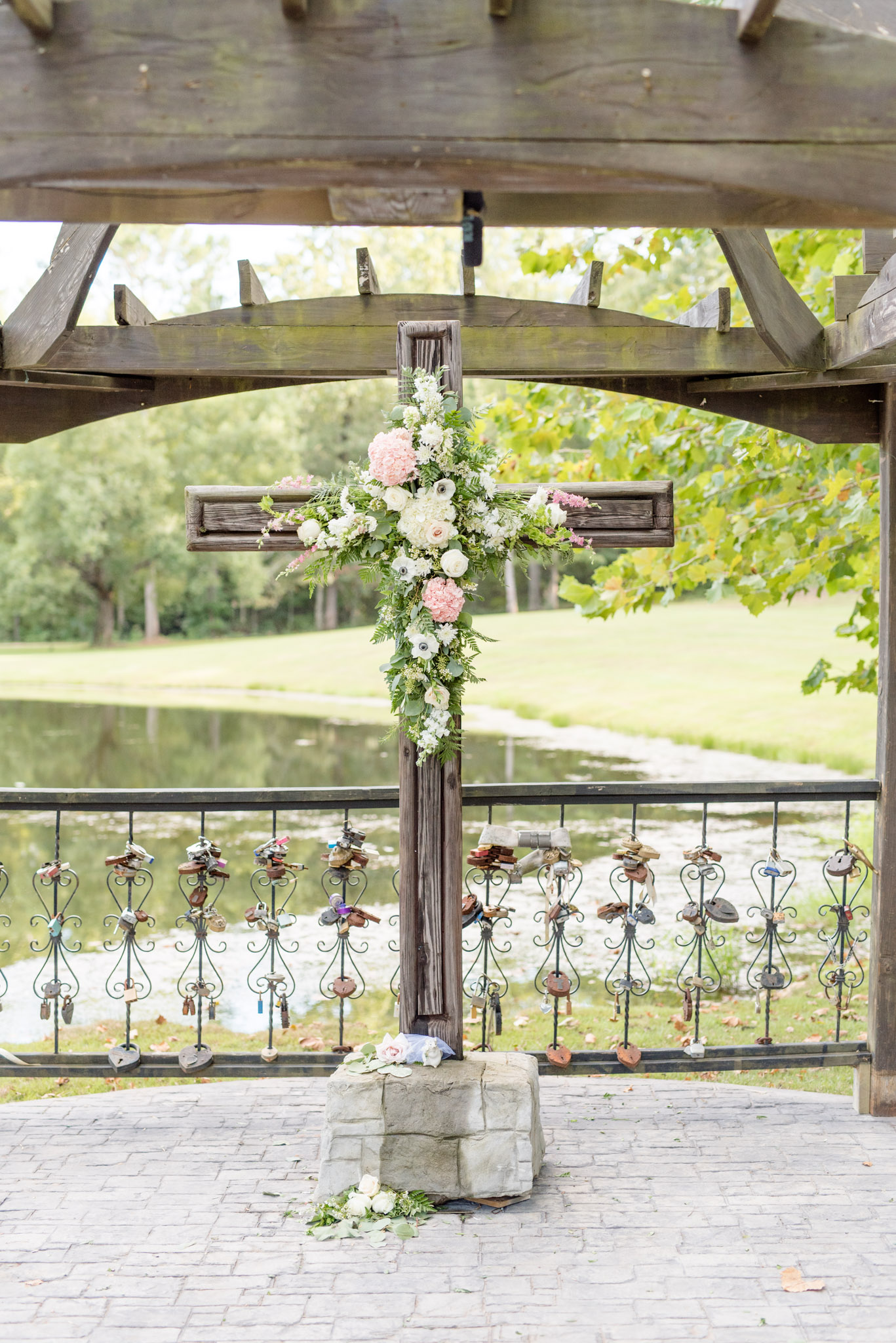 Cross with flowers at ceremony altar