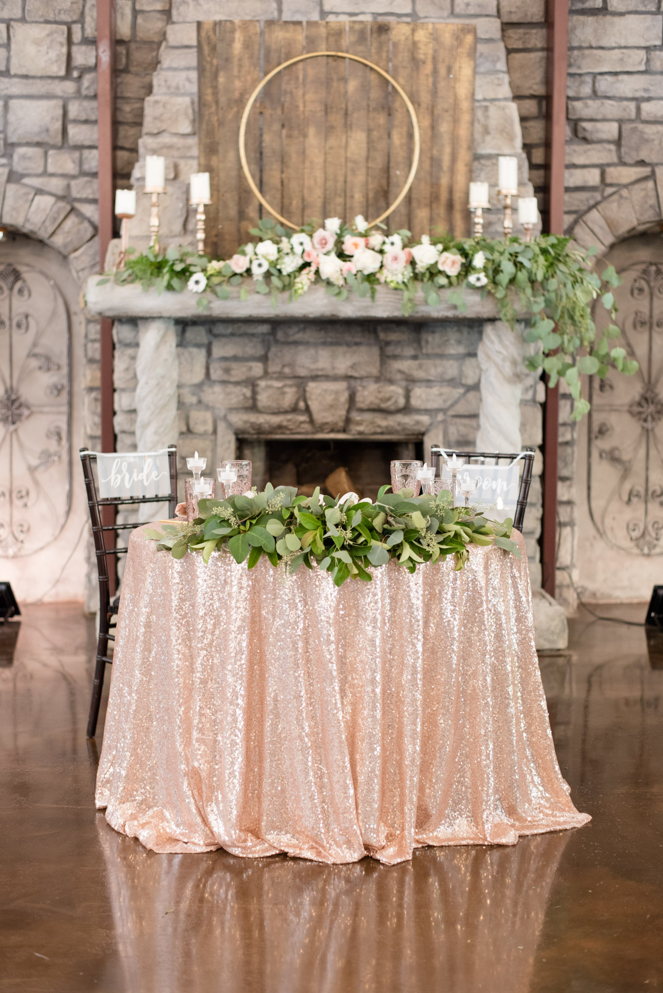 Bride and groom's table with flowers.