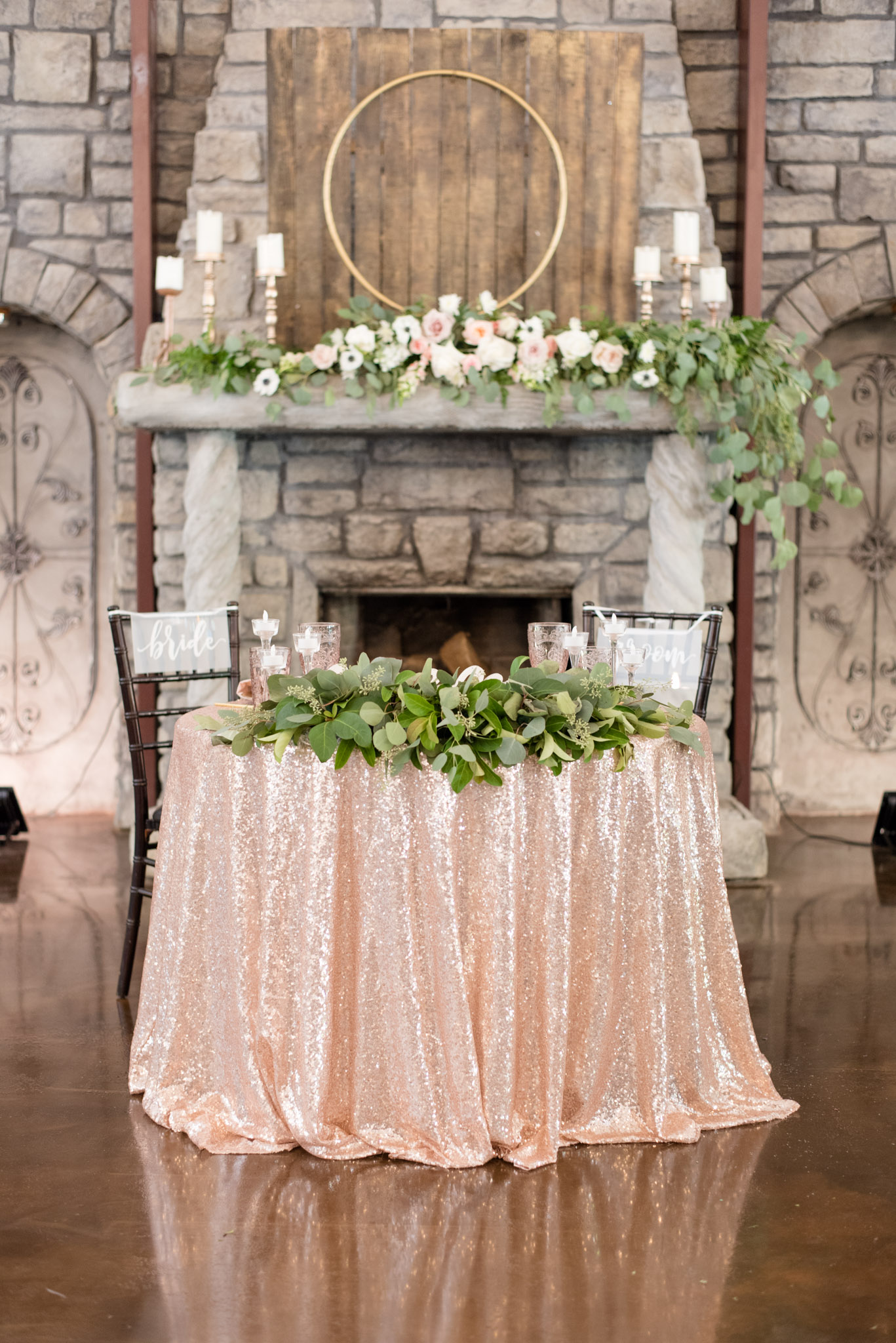 Bride and groom's table with flowers.
