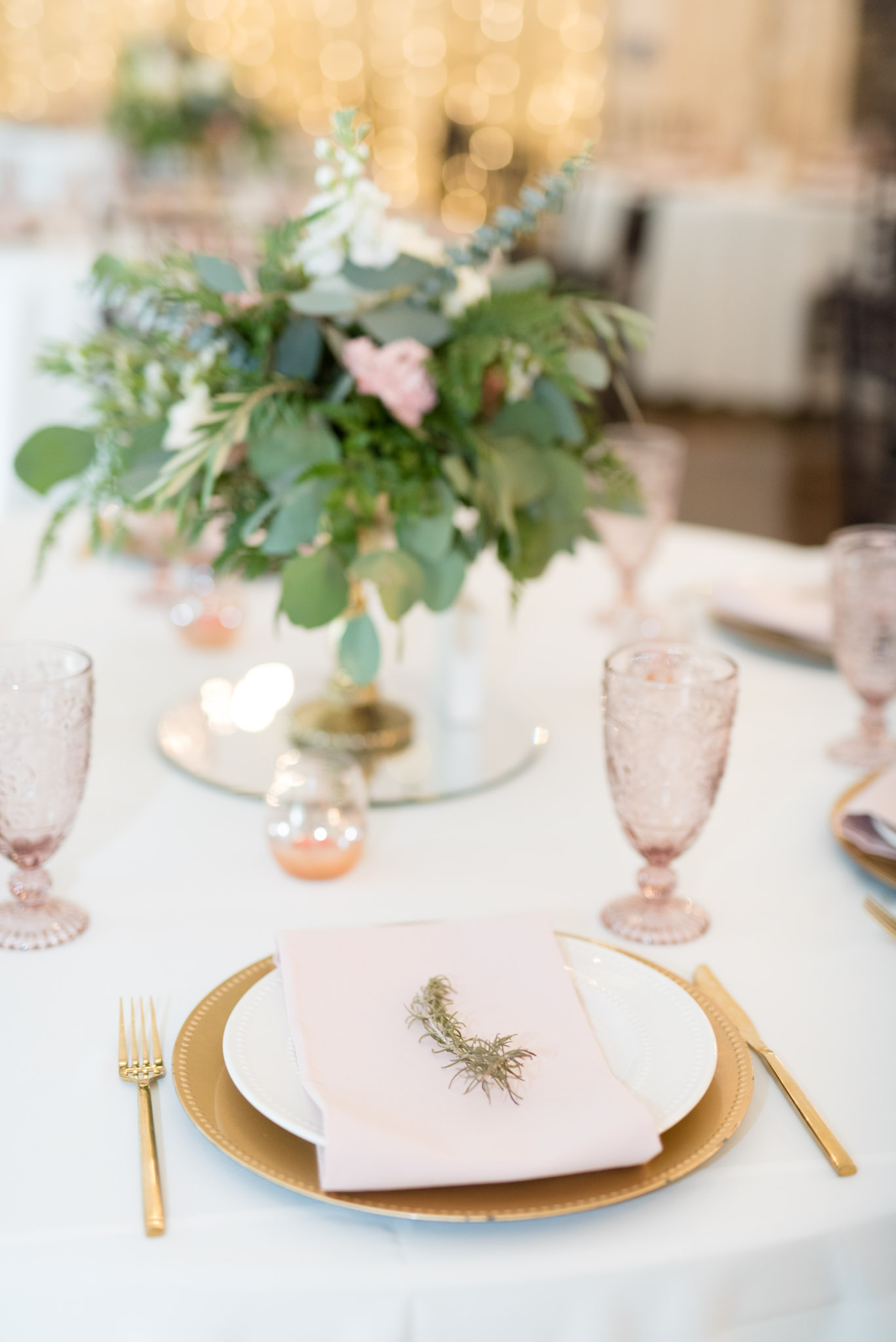 Pink and gold table settings.