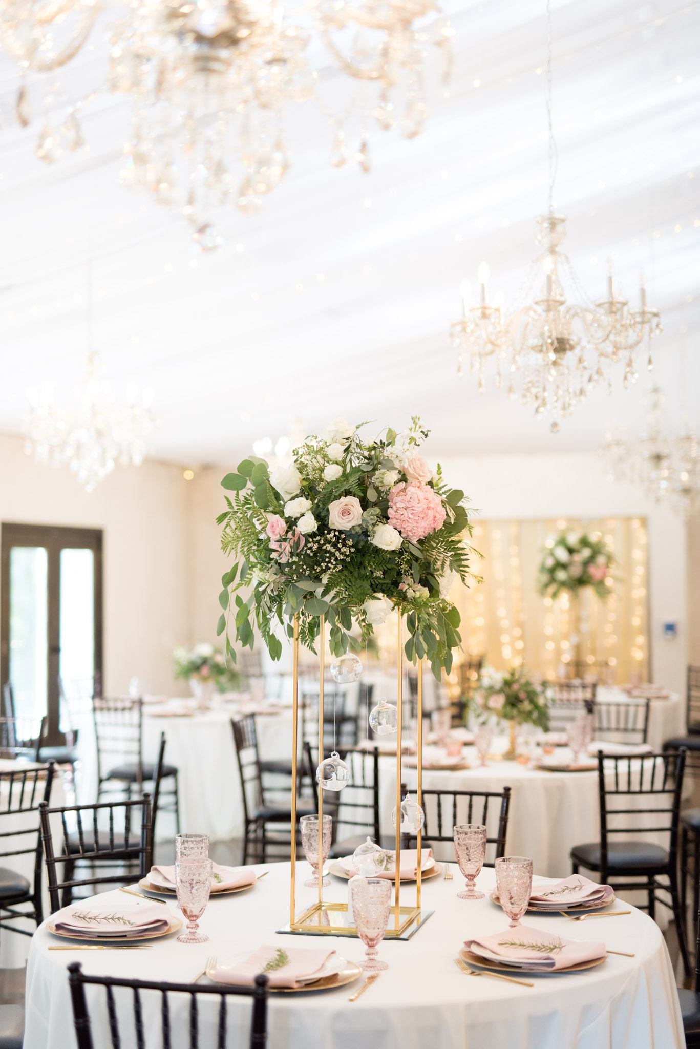 Pink and white florals at wedding reception.