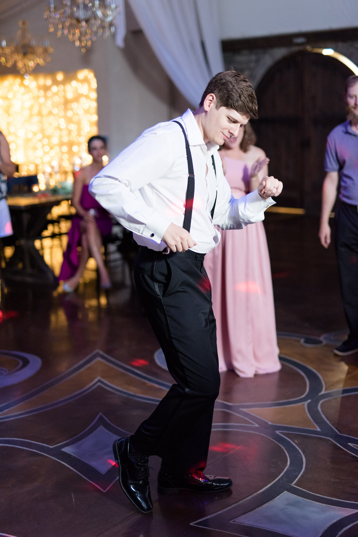 Groom dances during reception.