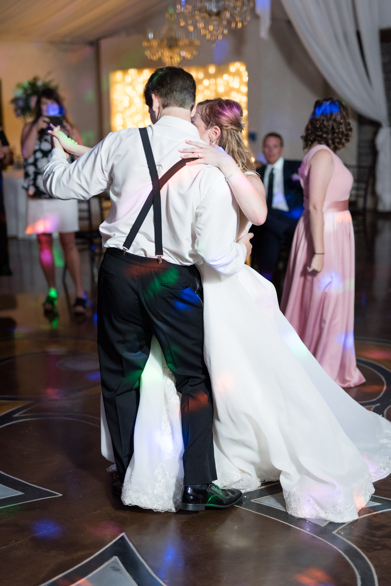 Bride and groom waltz at reception.