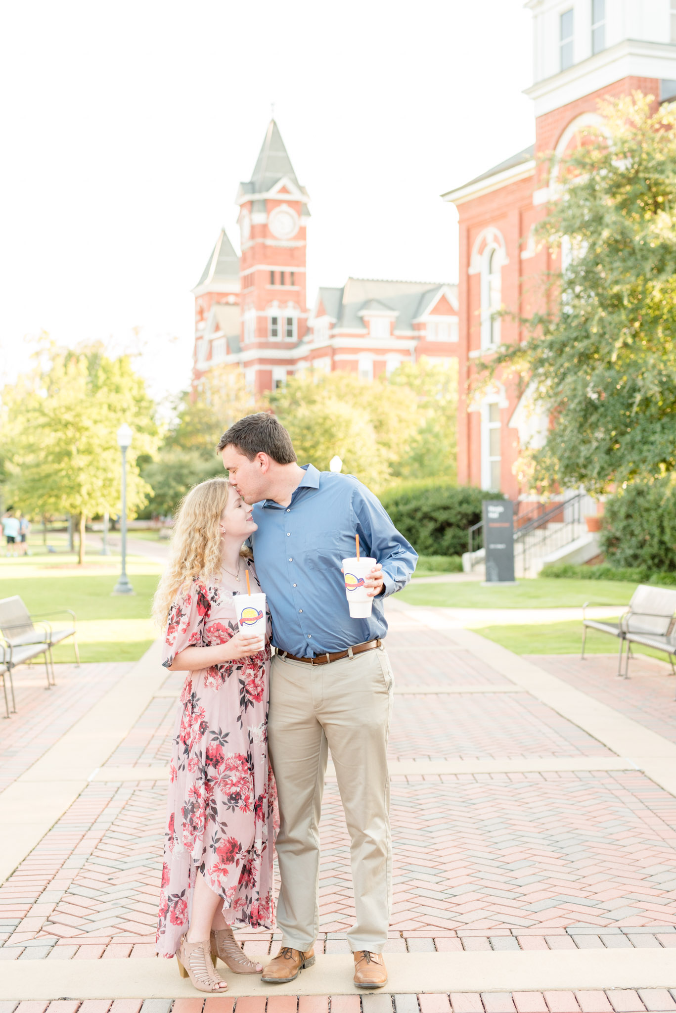 Couple holds Toomer's Drugs lemonade during engagement session.