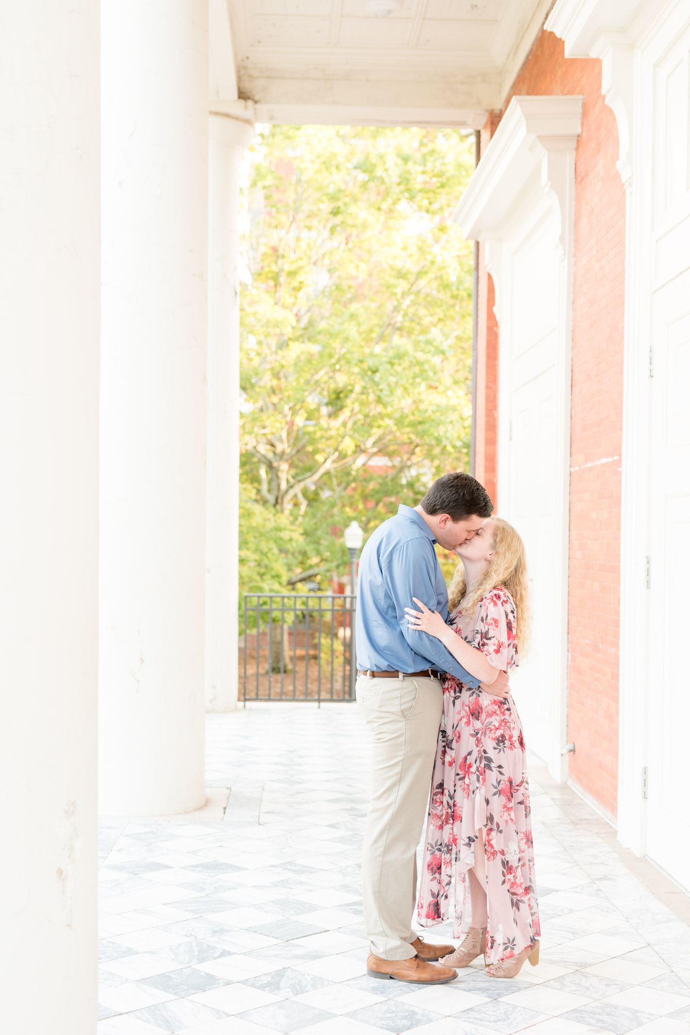 Couple kisses during engagement session at Auburn University.