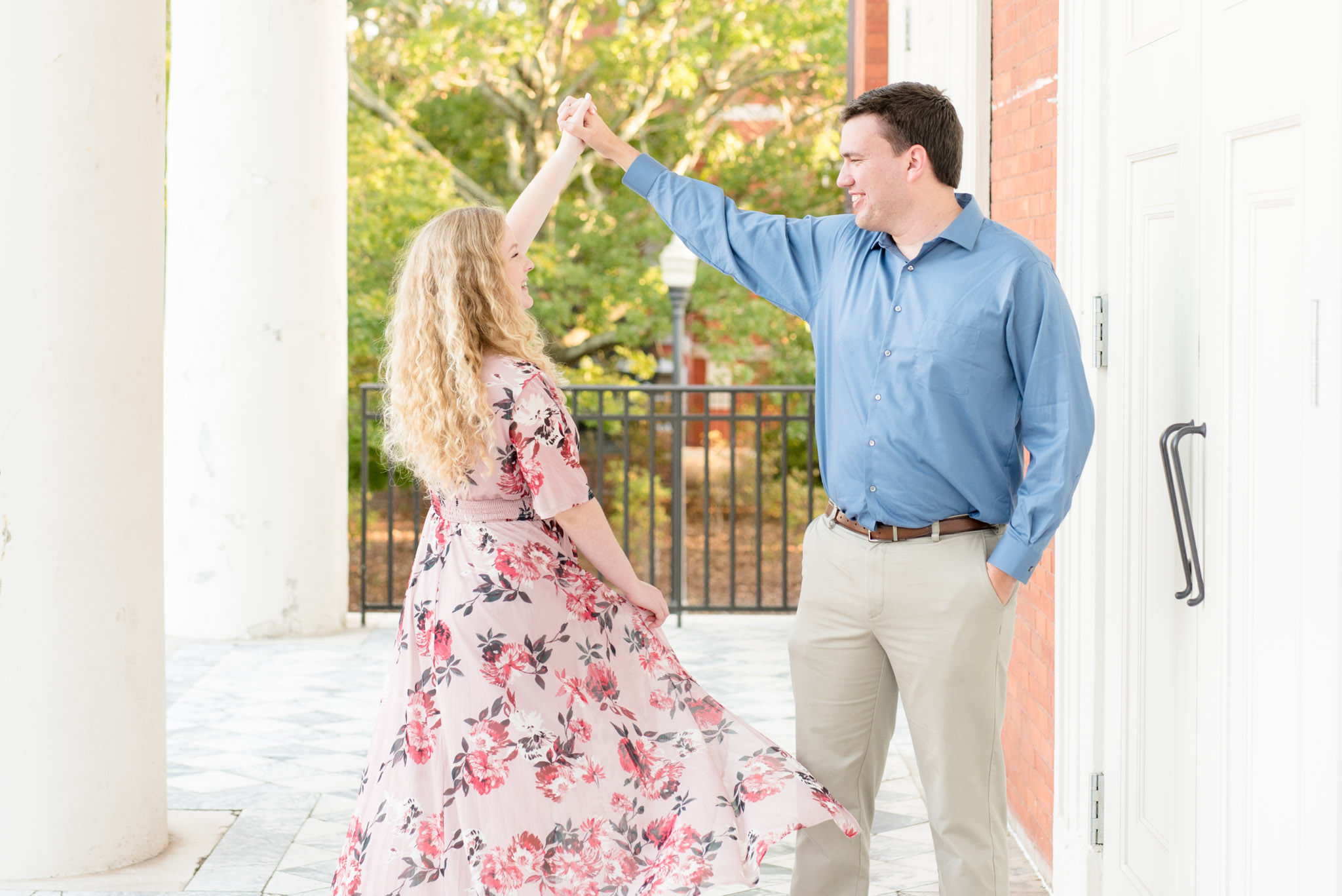 Man twirls woman at Auburn University.