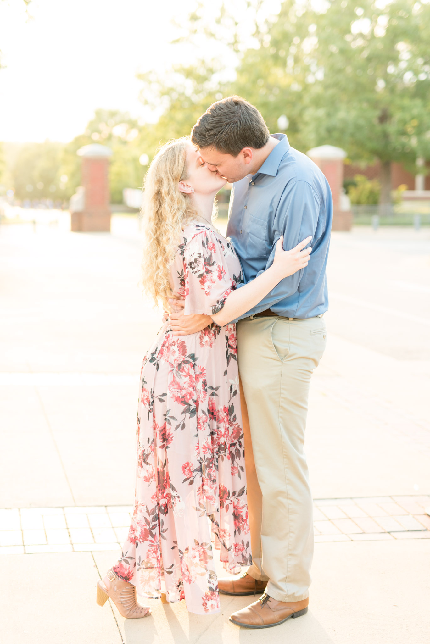 Engaged couple kisses at Auburn University.