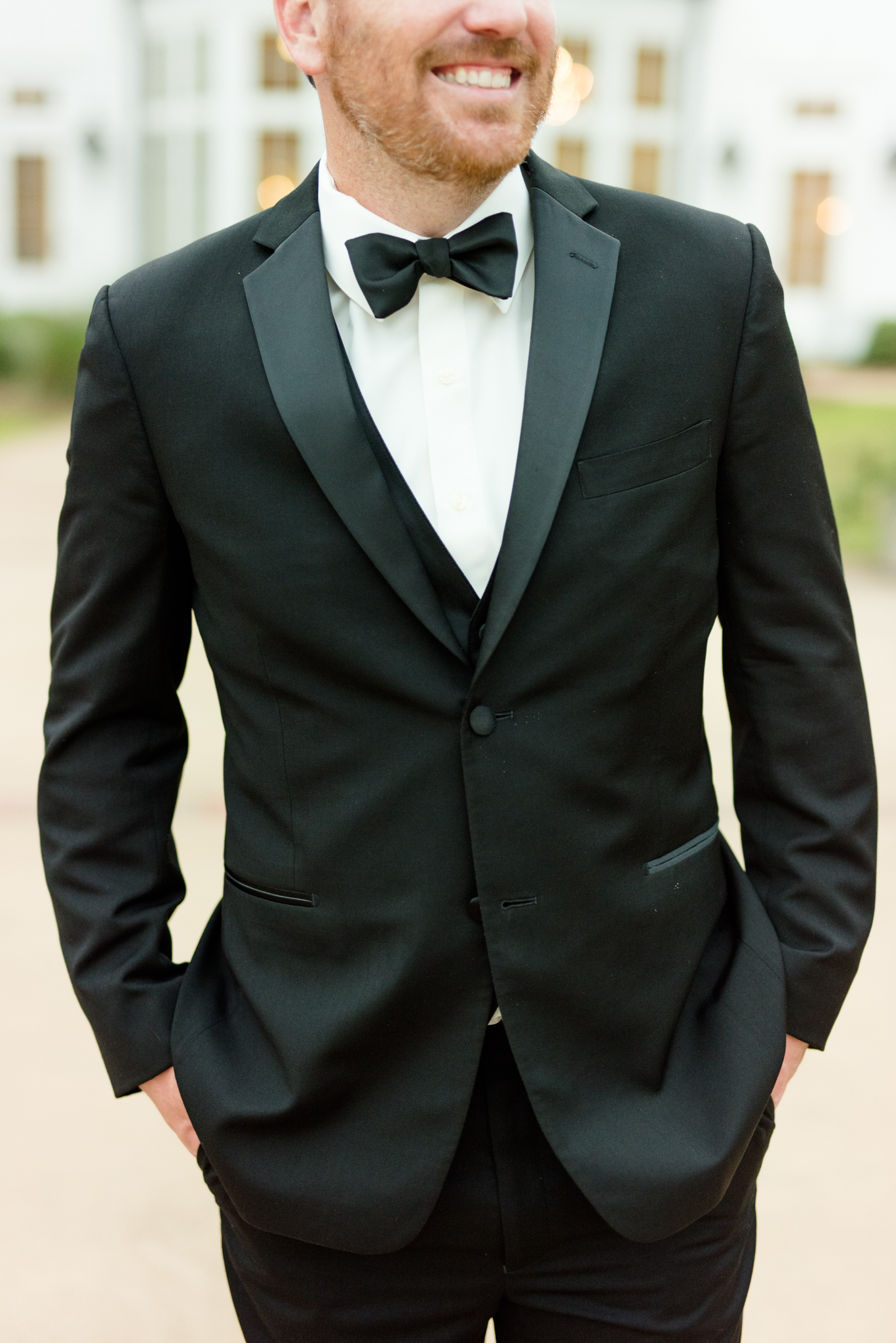 Closeup of grooms black tux