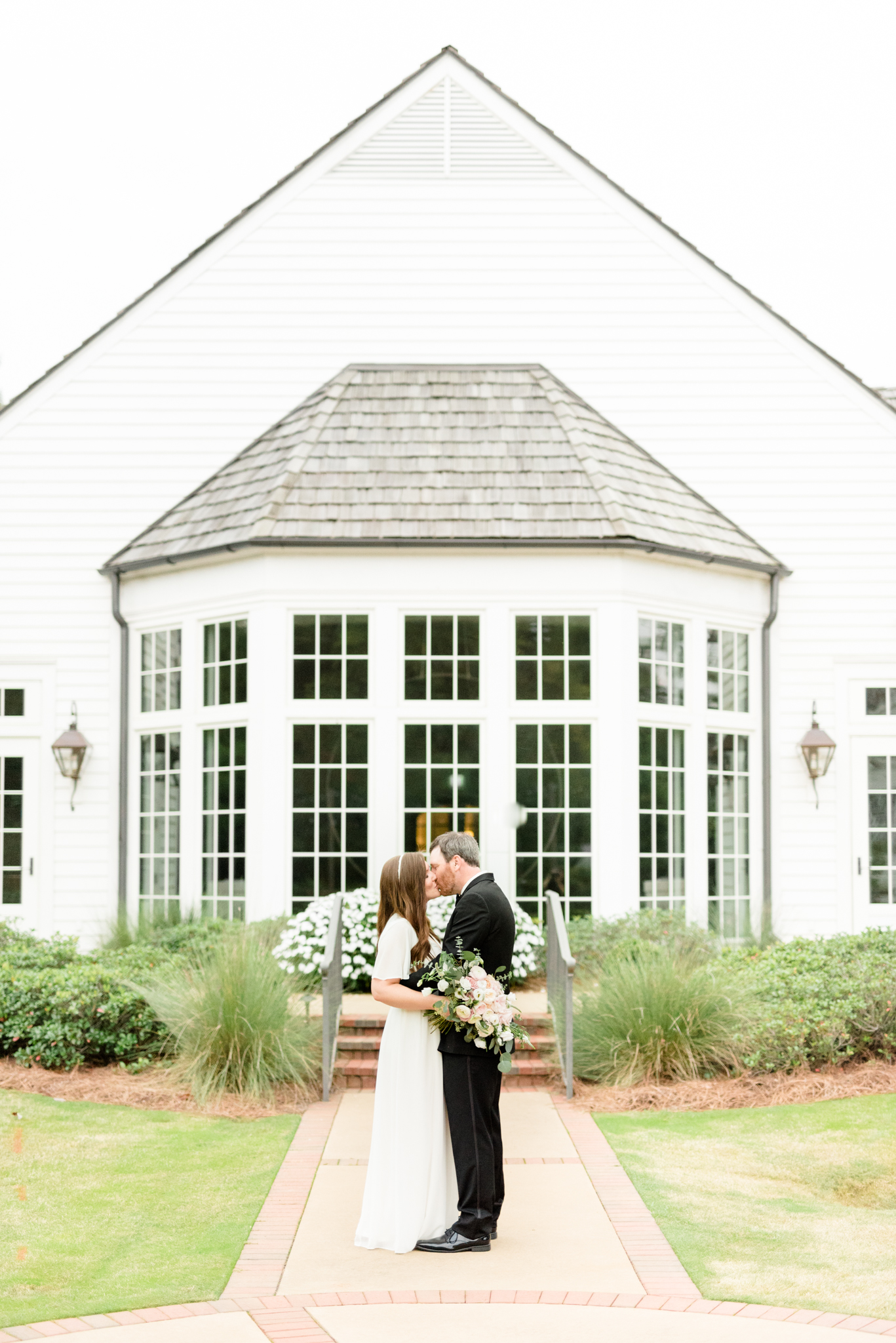 Couple kisses during their vow renewal.