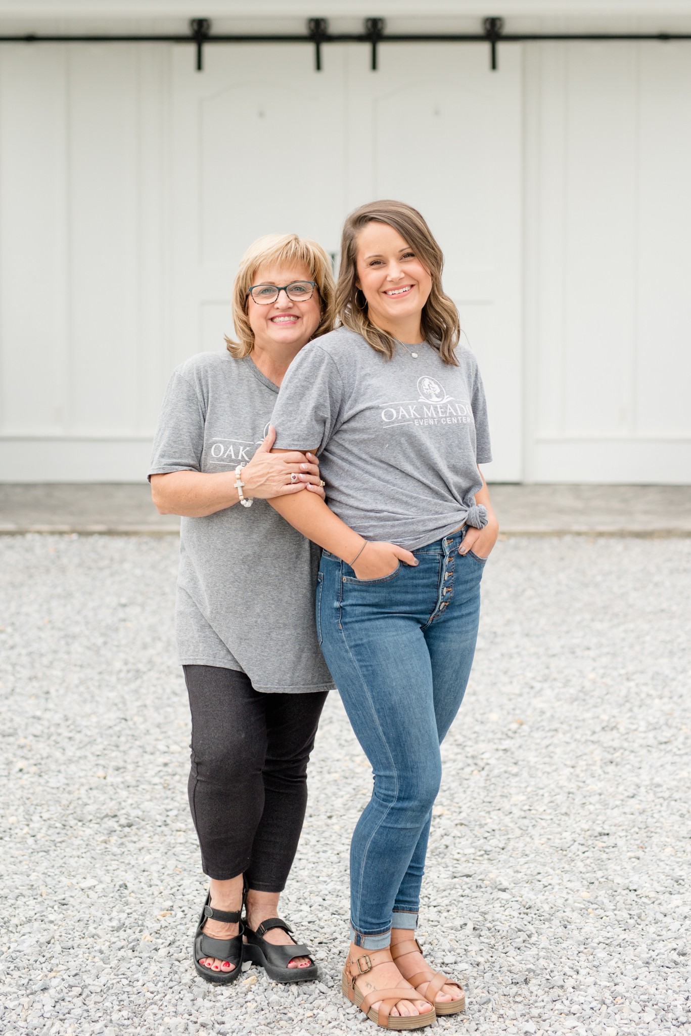 Venue owners smile at camera.