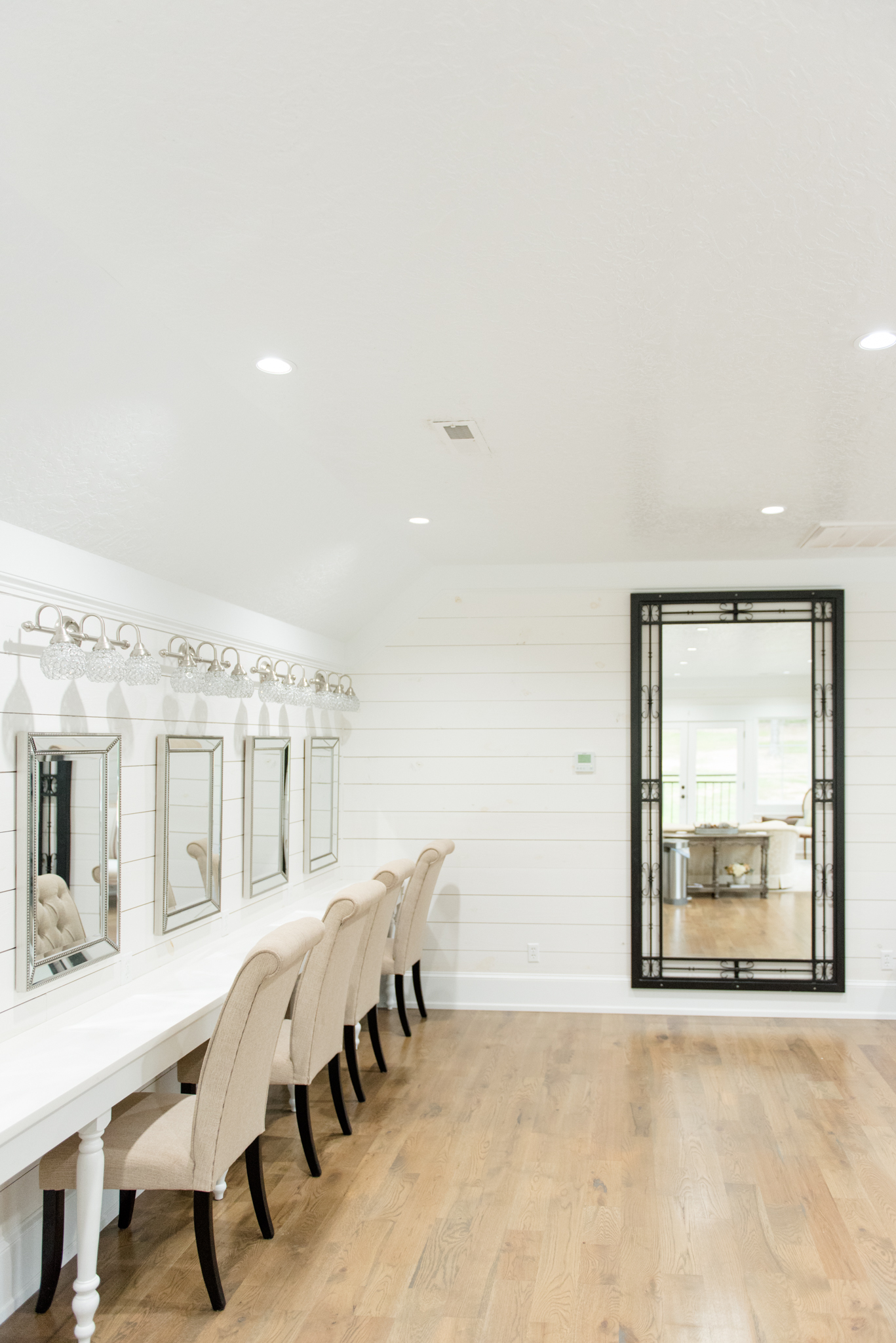 Hair and makeup station and large mirror.