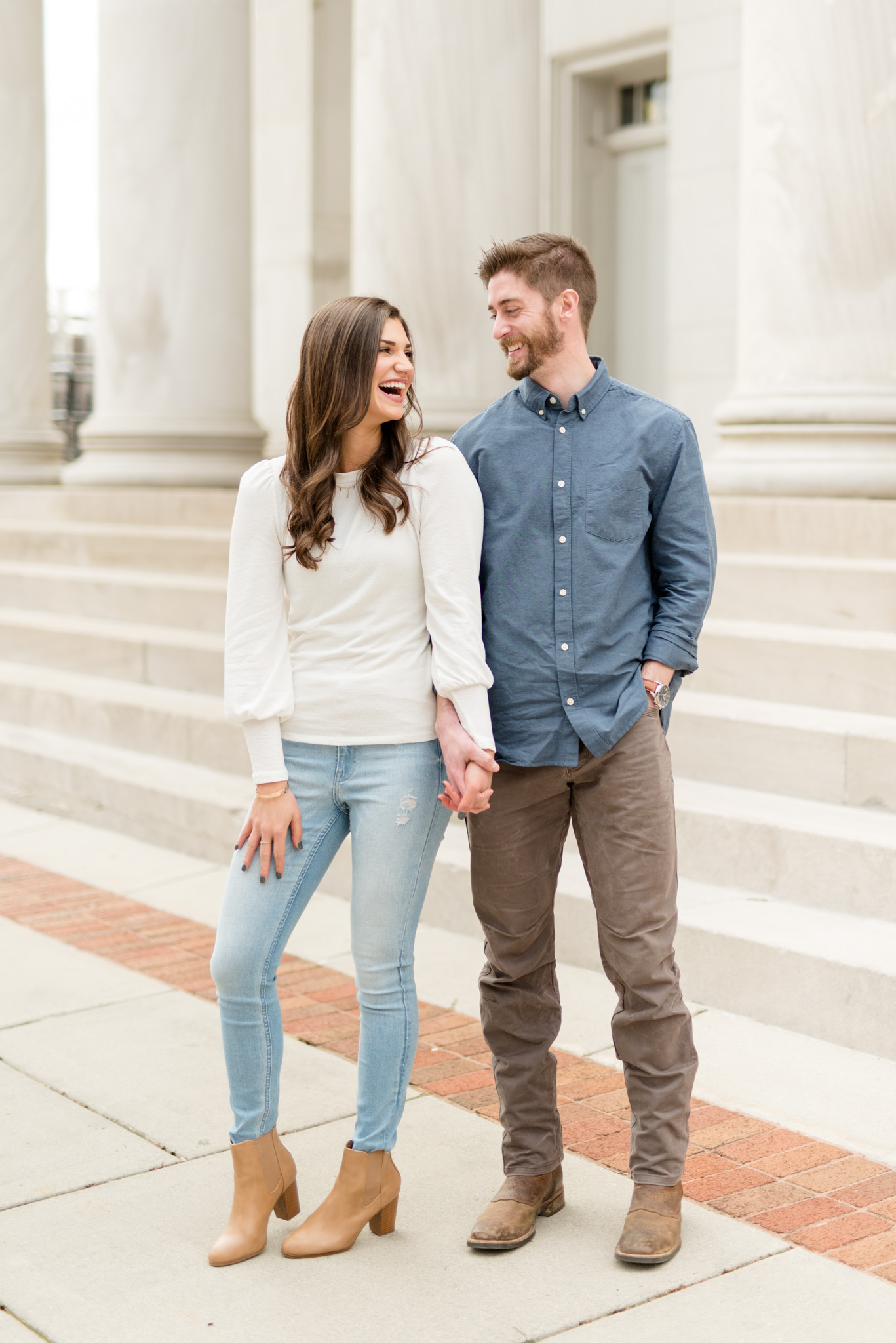 Couple looks at each other and laughs.