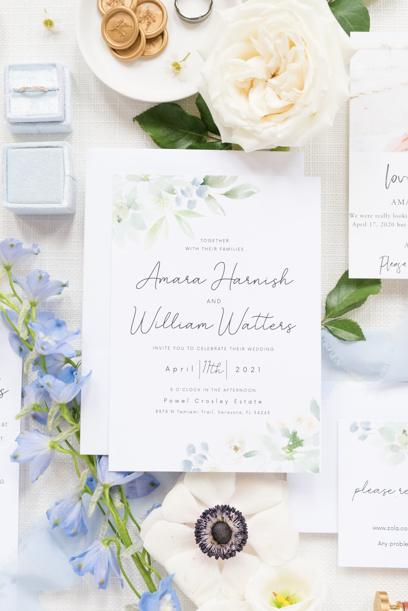 Wedding invitation surrounded by flowers.