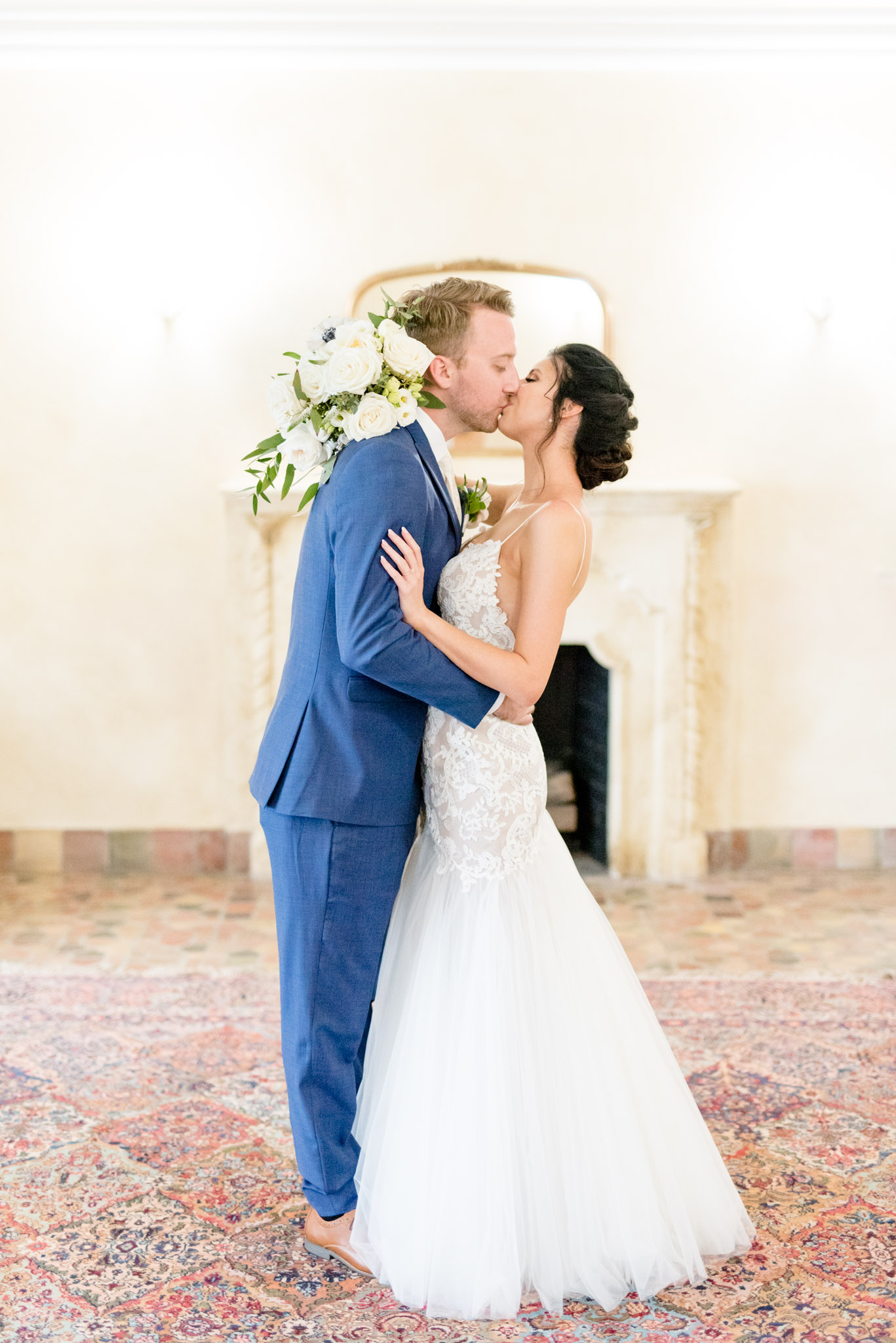 Bride and groom kiss.