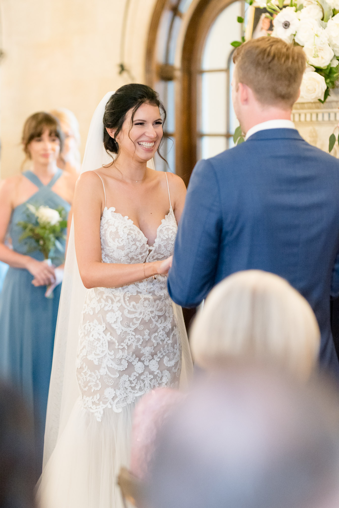 Bride laughs during ceremony.