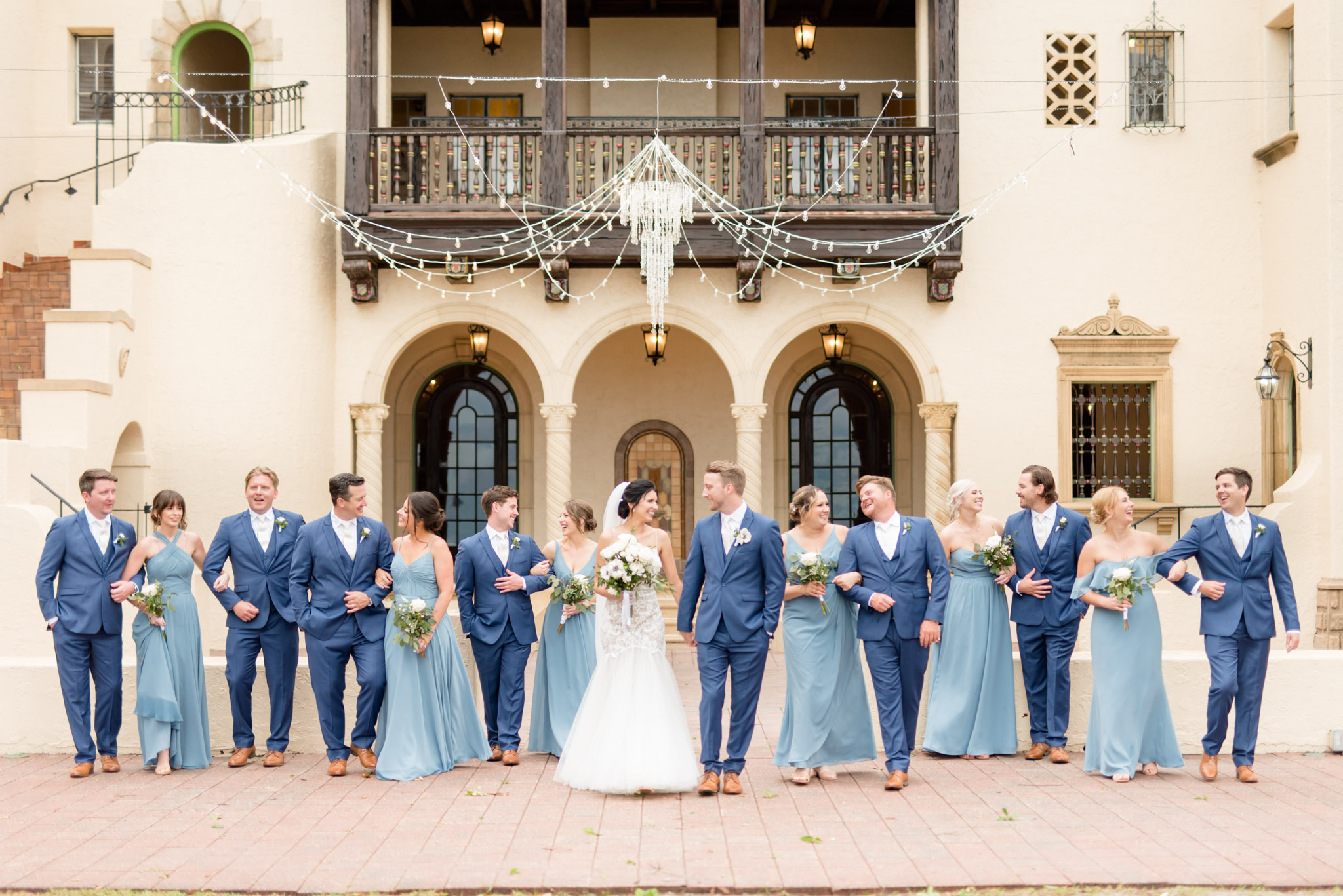 Wedding party walks together.