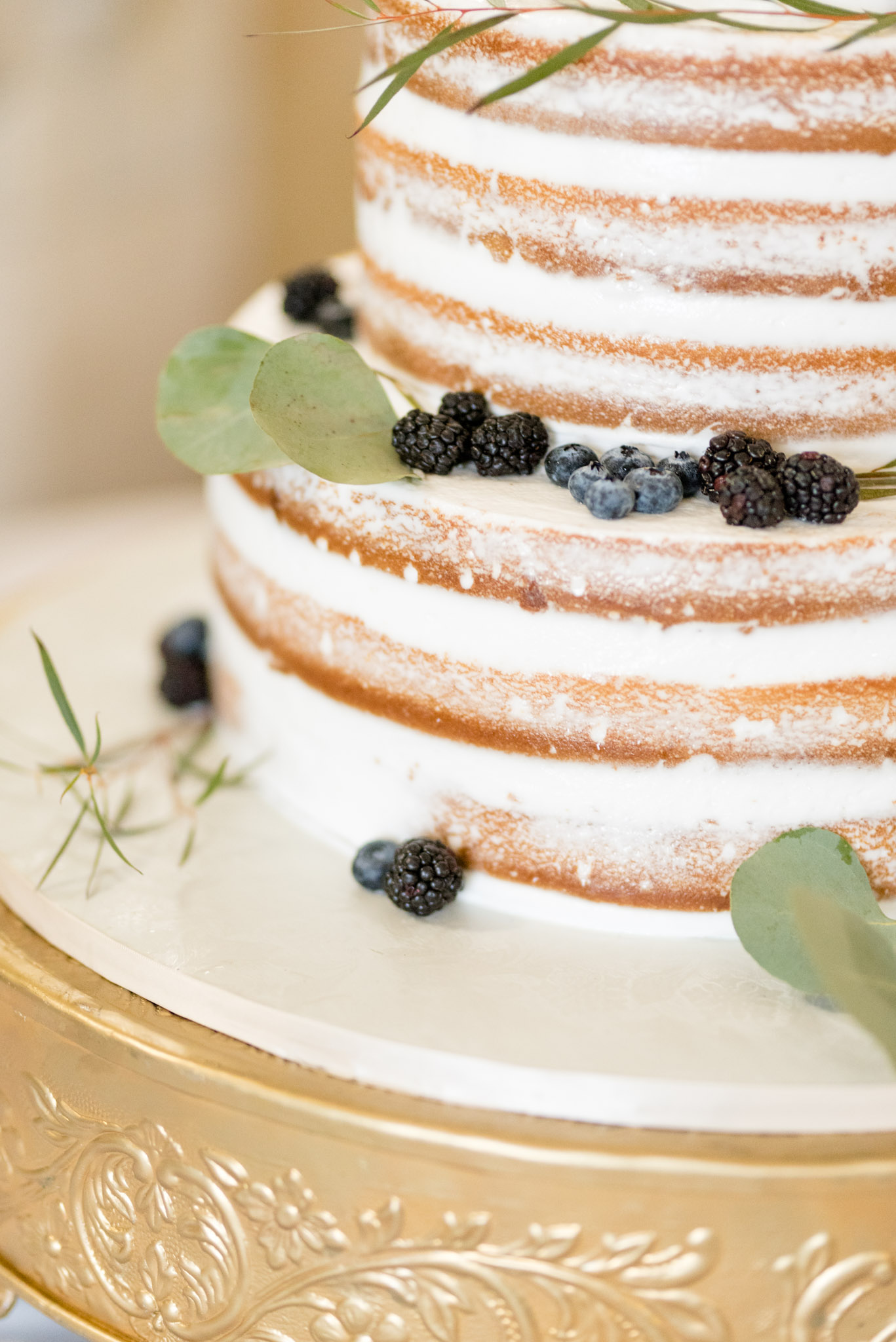Blackberries and blueberries on wedding cake.
