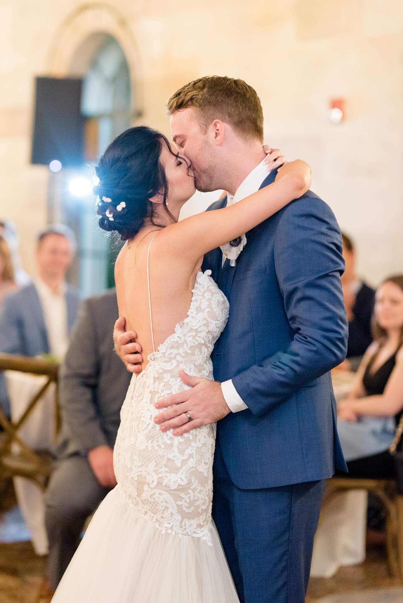Couple kisses during first dance.