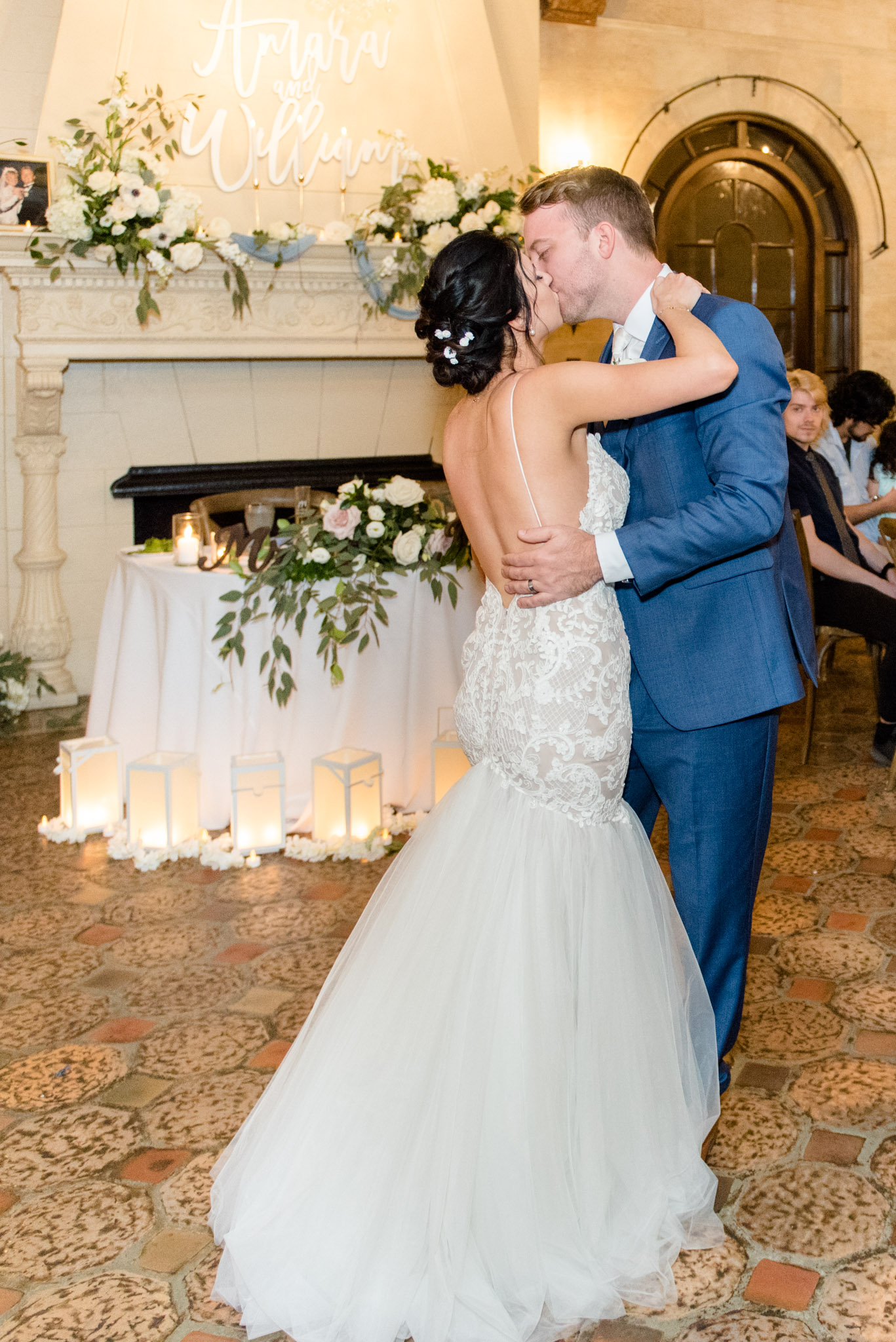 Bride and groom kiss during first dance.