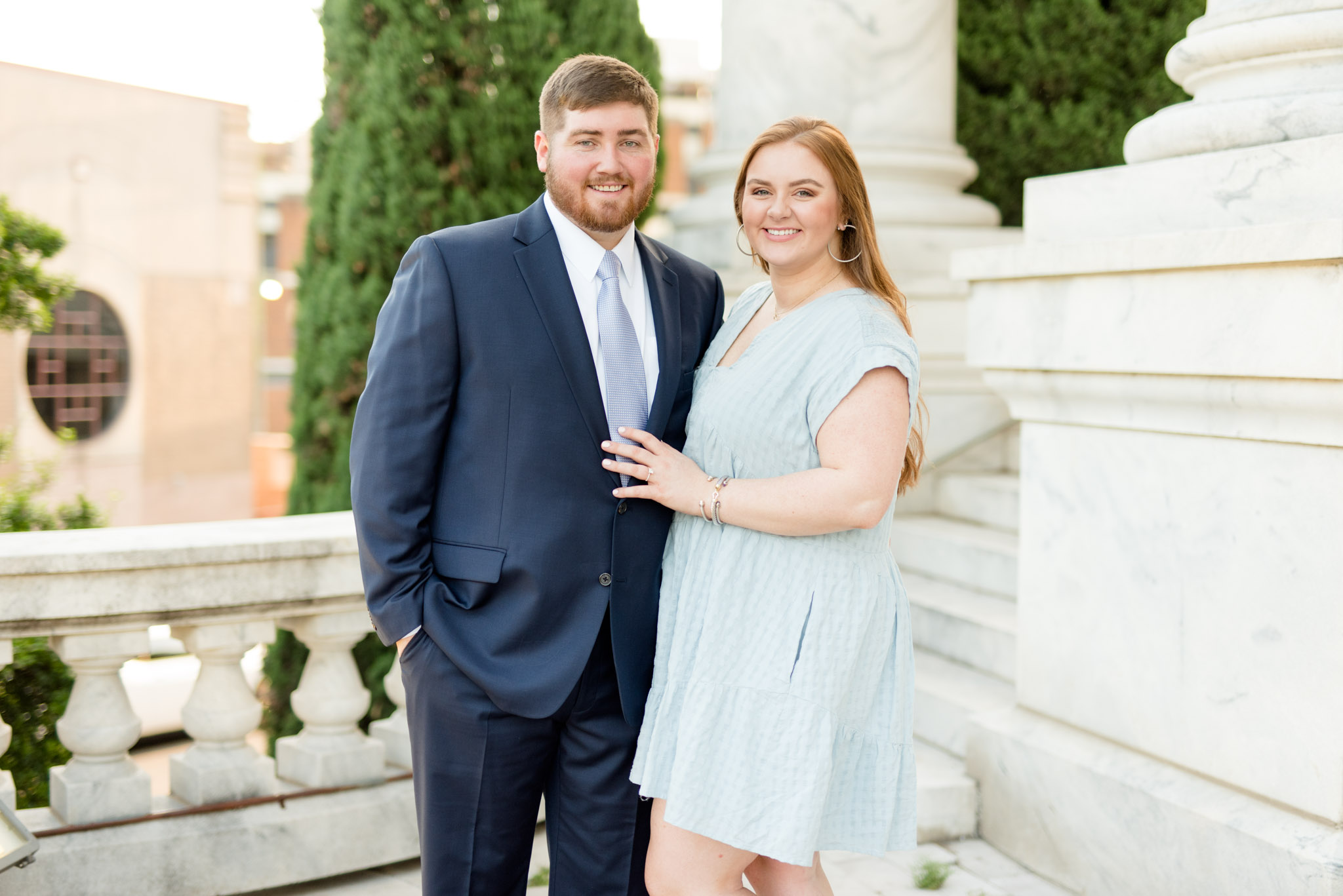 Couple smiles at camera.