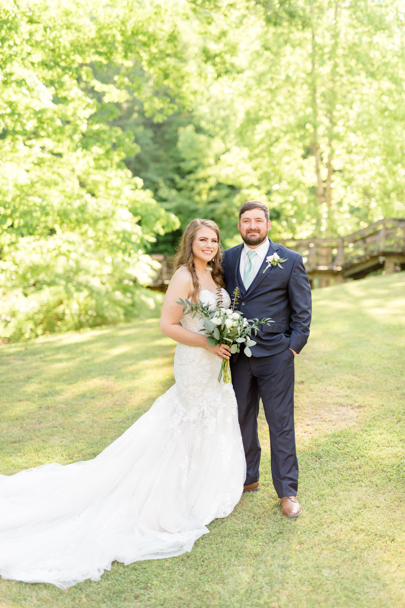 Bride and groom smile together.