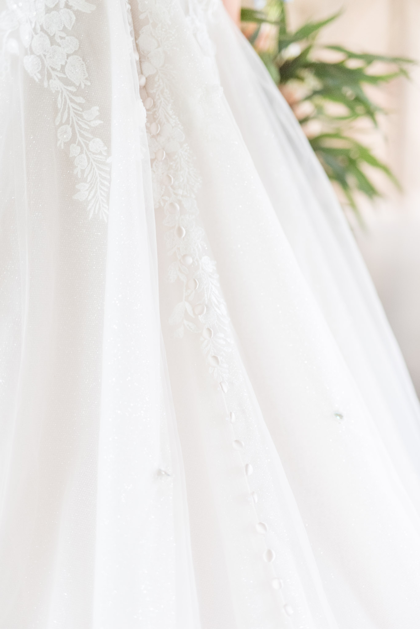 Bride's wedding dress closeup.