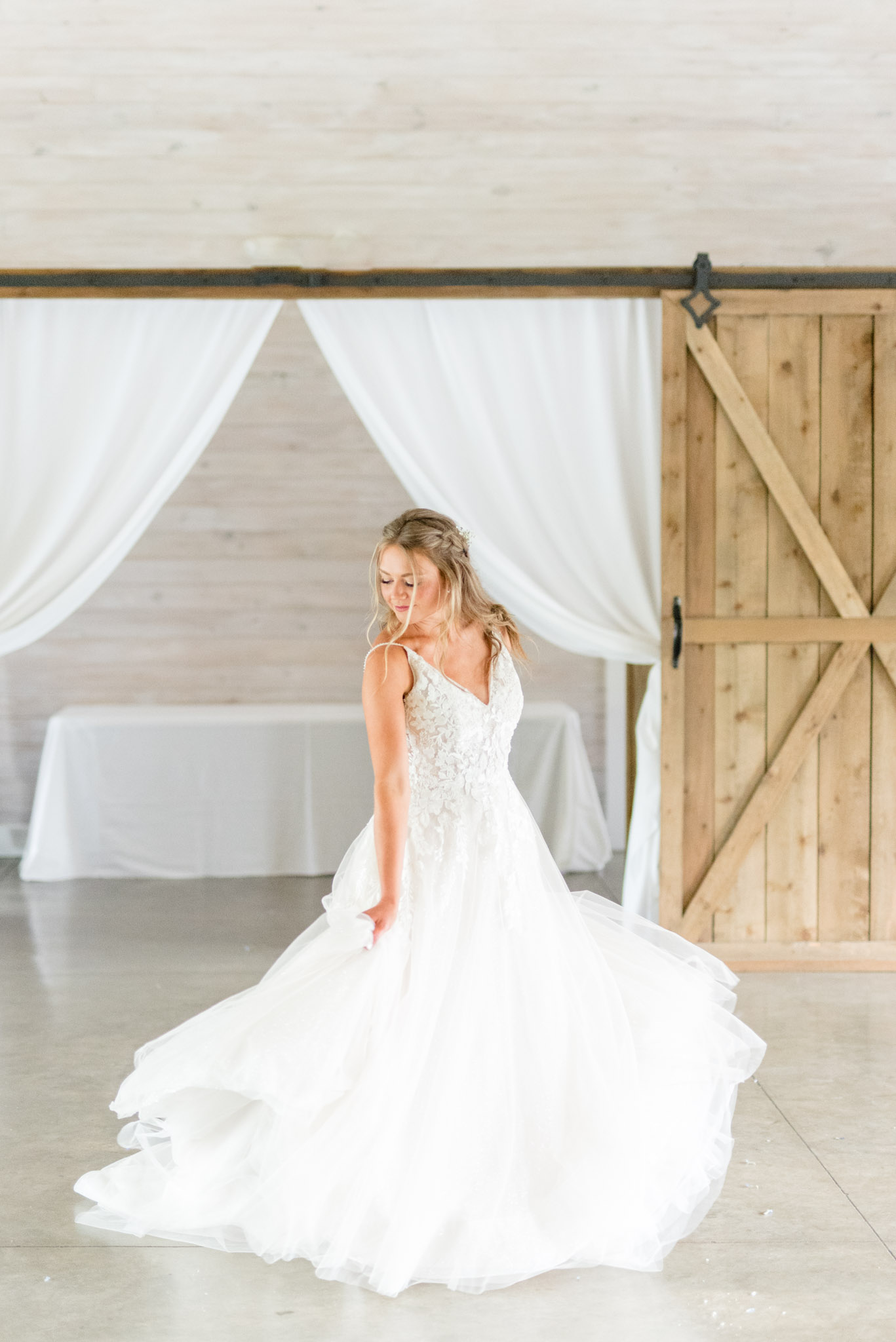 Bride twirls dress.