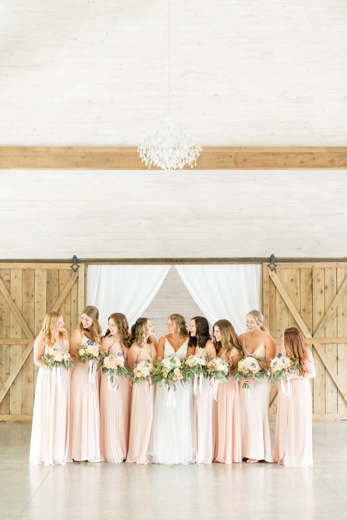 Bride and bridesmaids smileat Park Crest Event Facility.