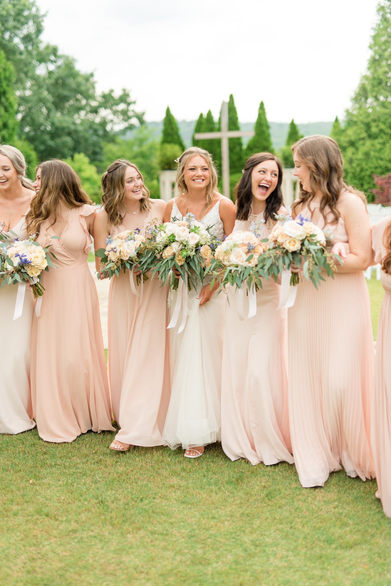 Bridal party walks together.