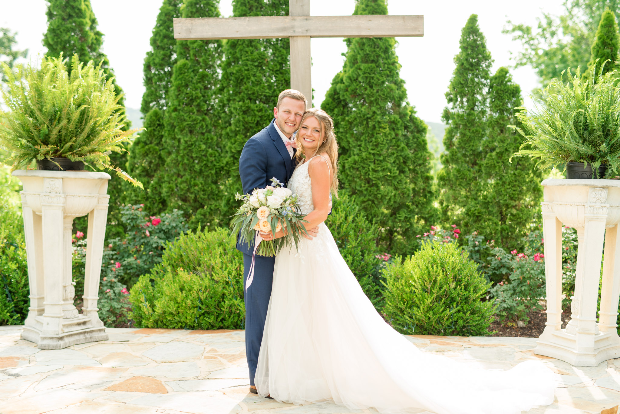 Bride and groom smile at camera.