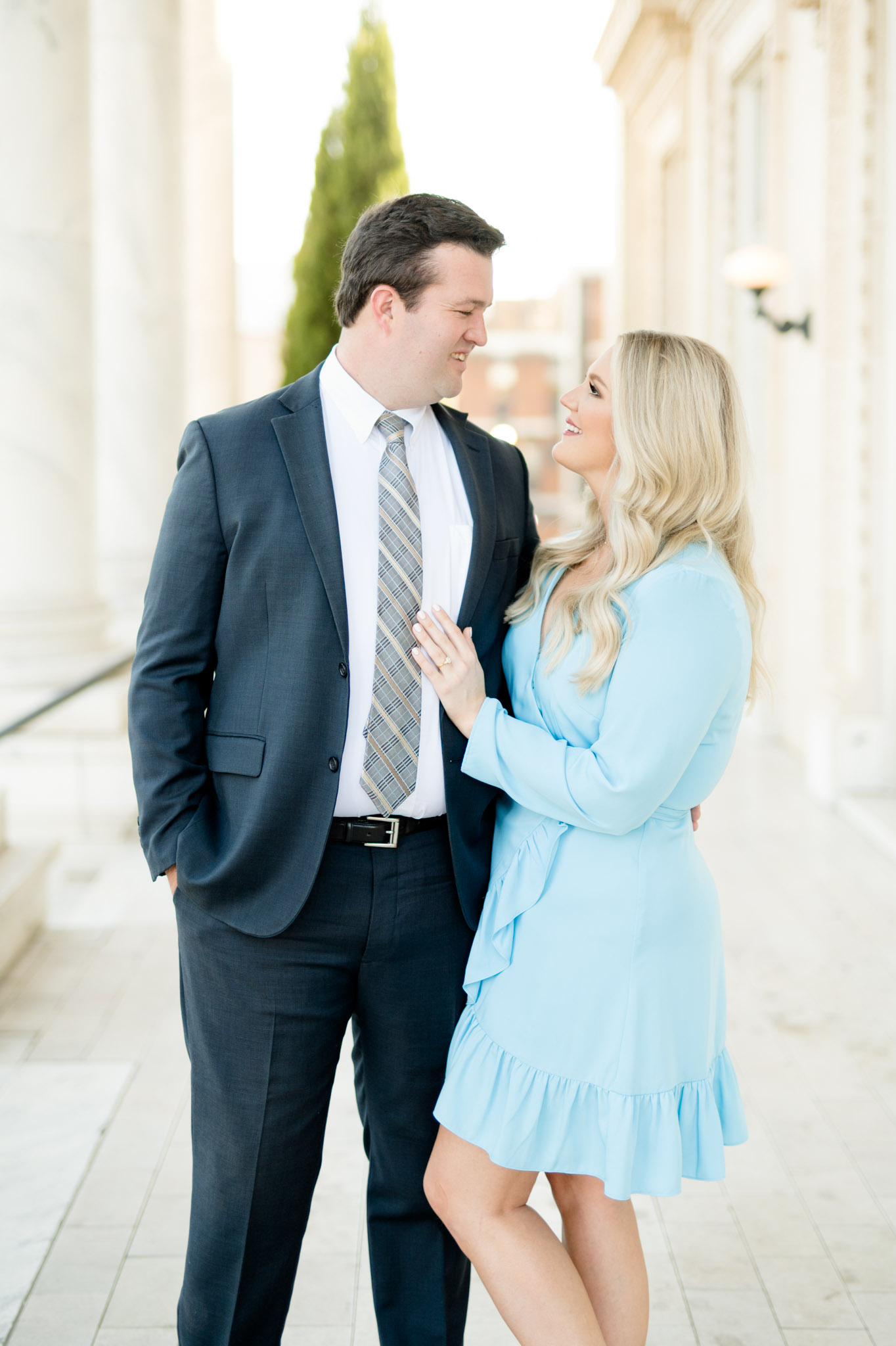 Engaged couple looks at each other.