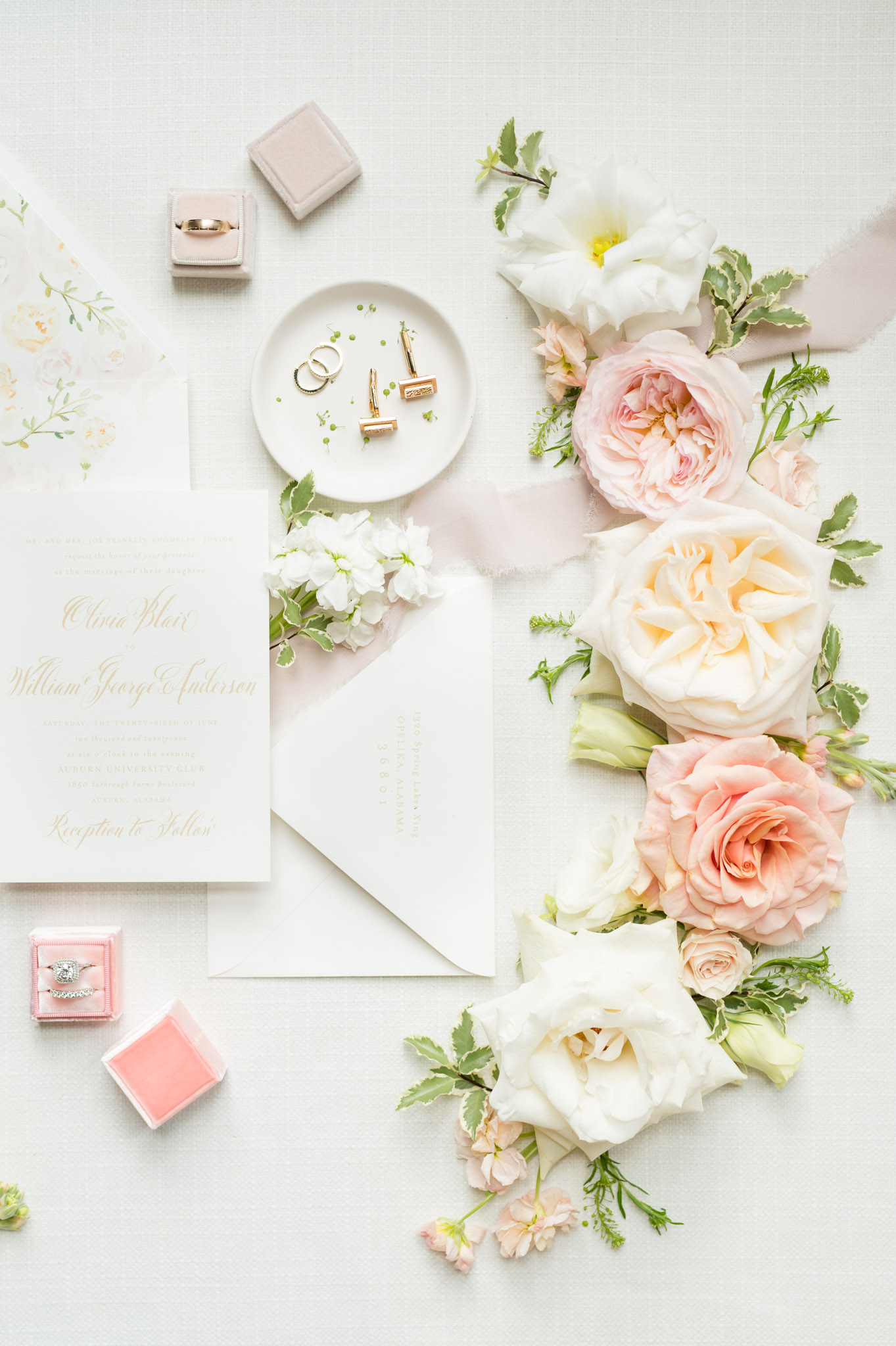 Floral arrangements and invitation suites.
