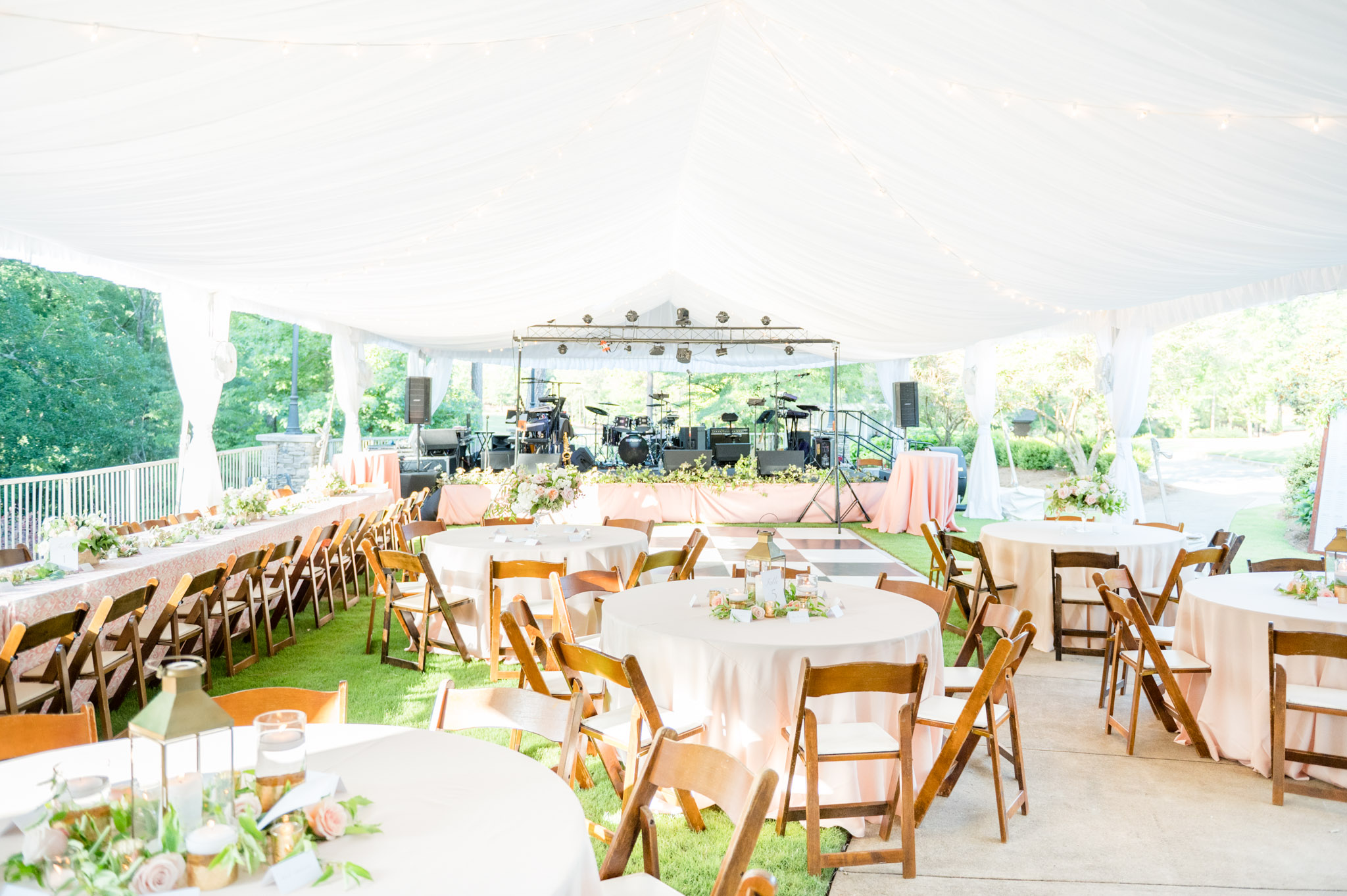 Wedding reception tent with blush and white details.