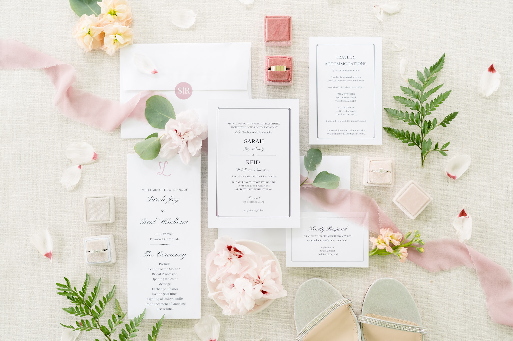 White and black invitation suite with pink accents.