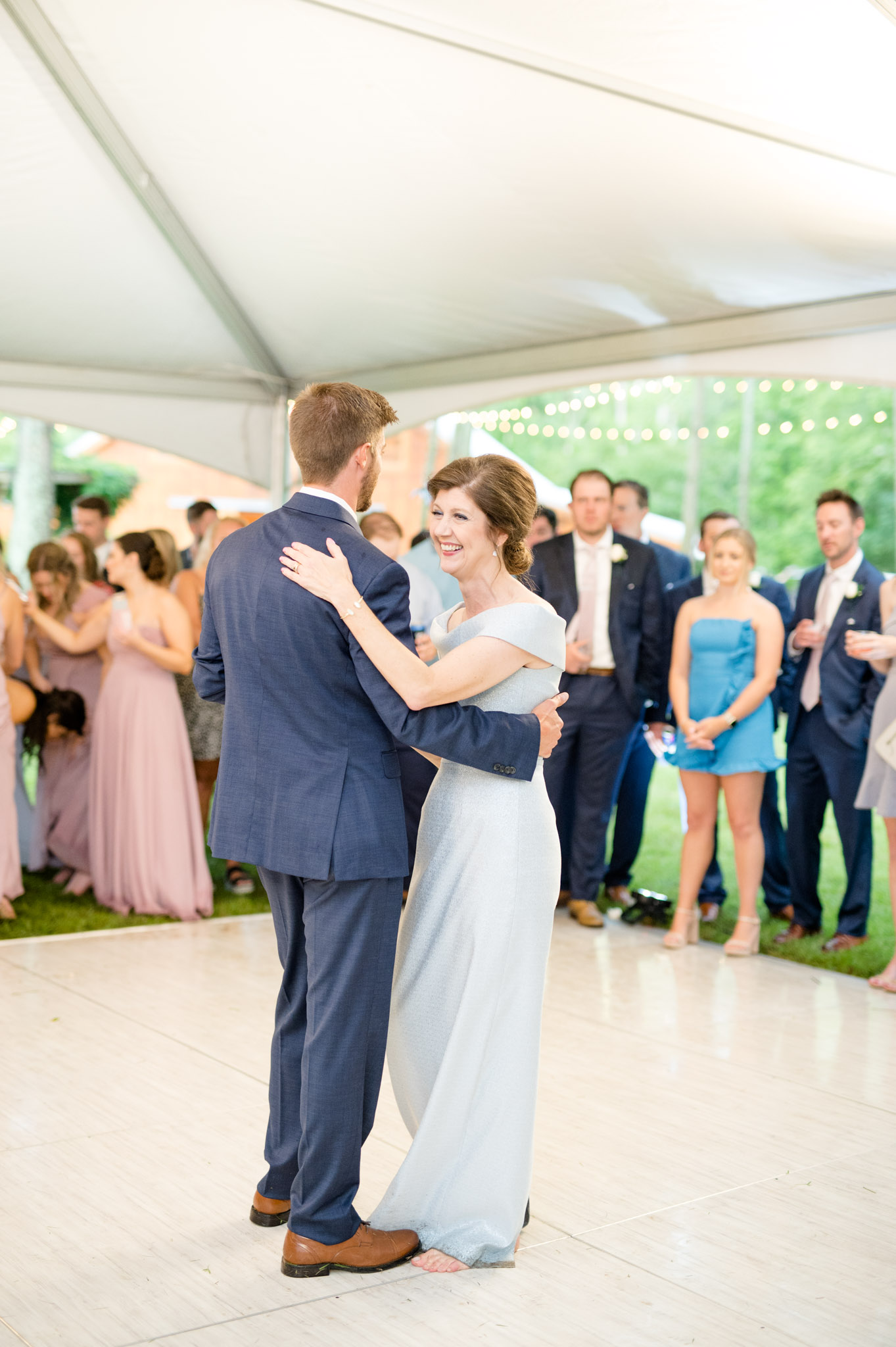 Groom dances with his mother.