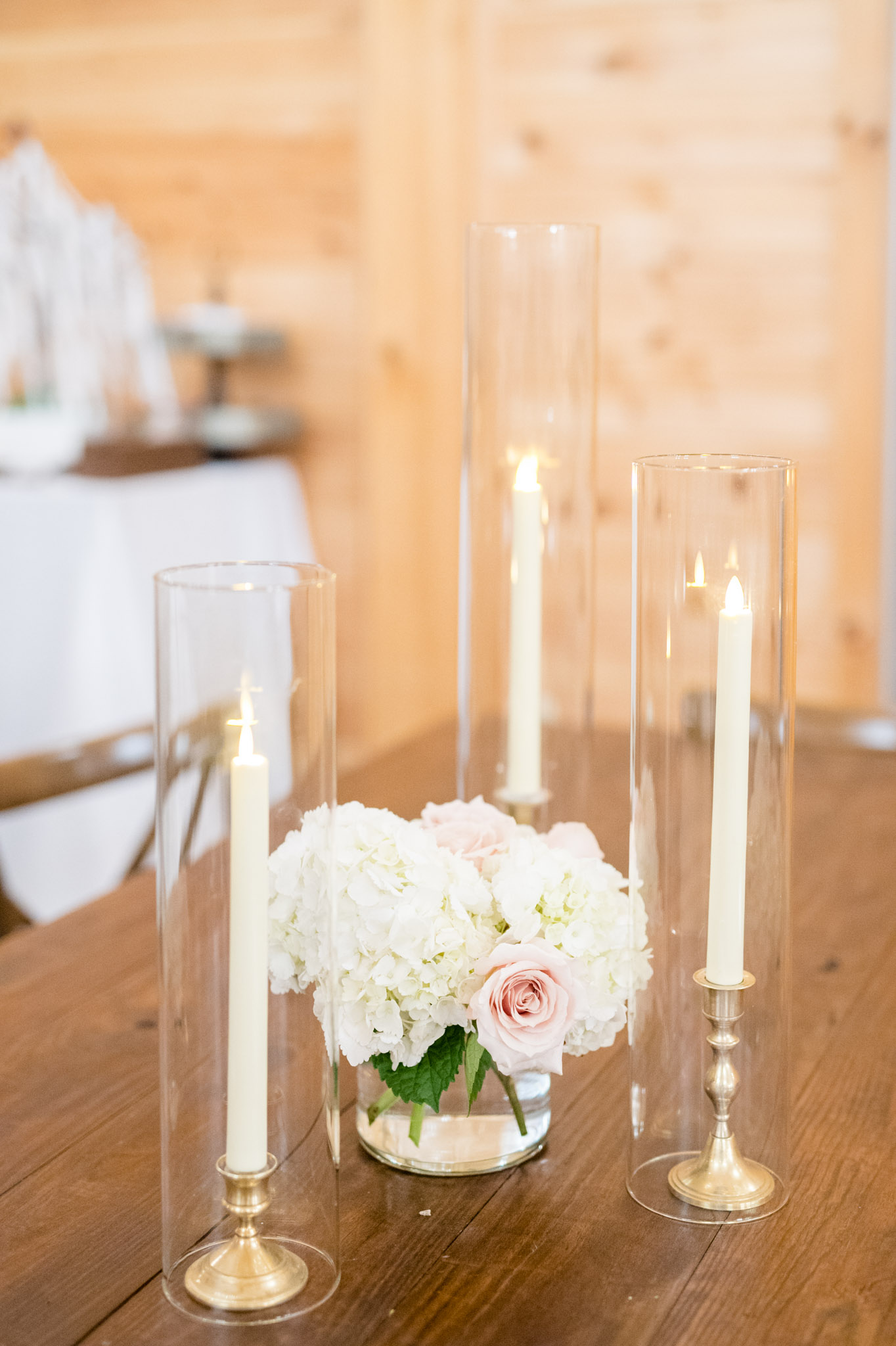 Flowers and candles on reception table.