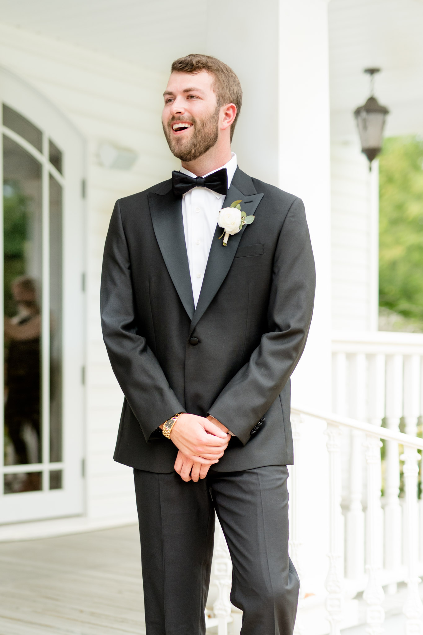Groom smiles as he sees the bride for the first look.