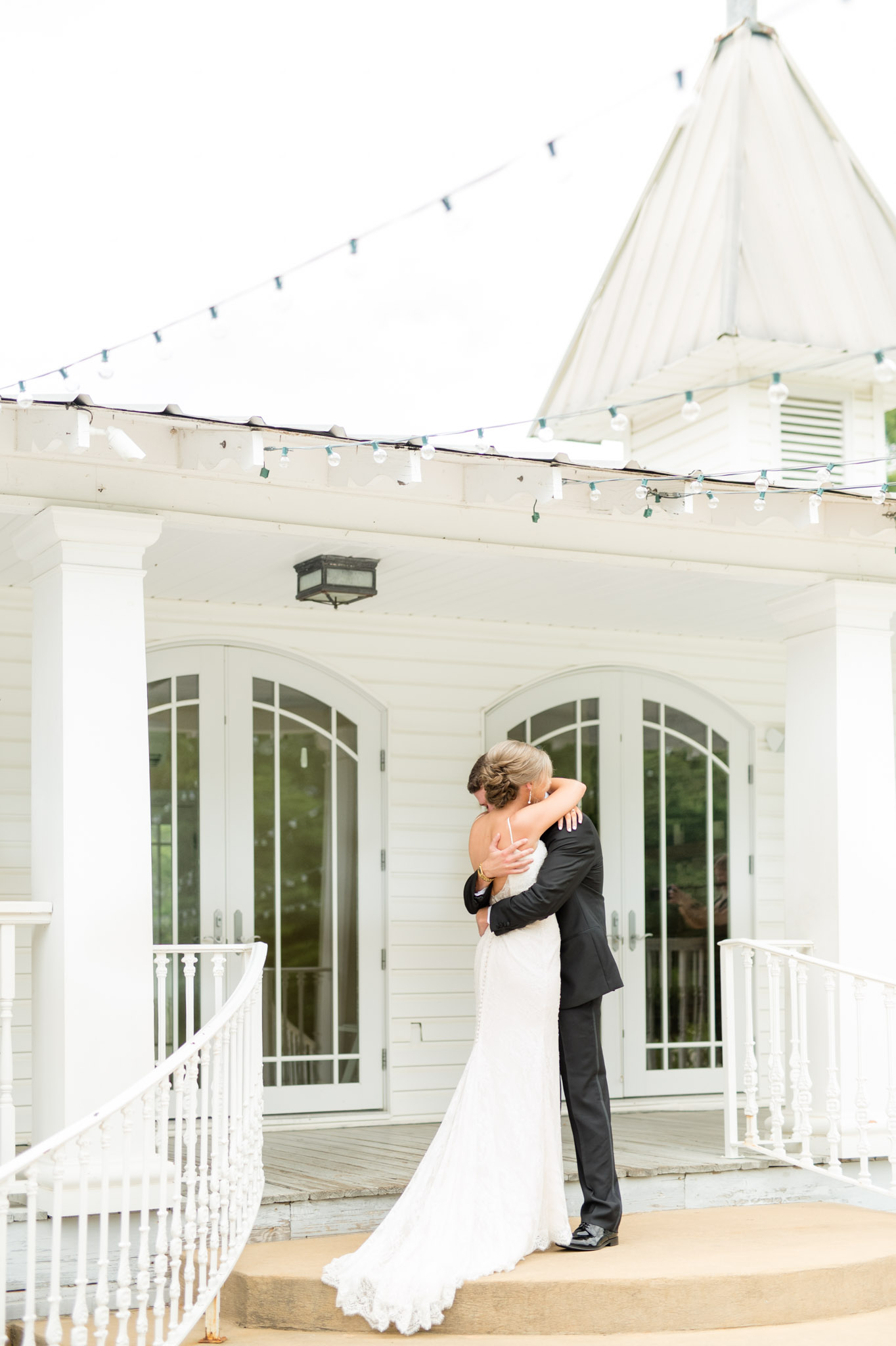 Bride and groom hug during first look.