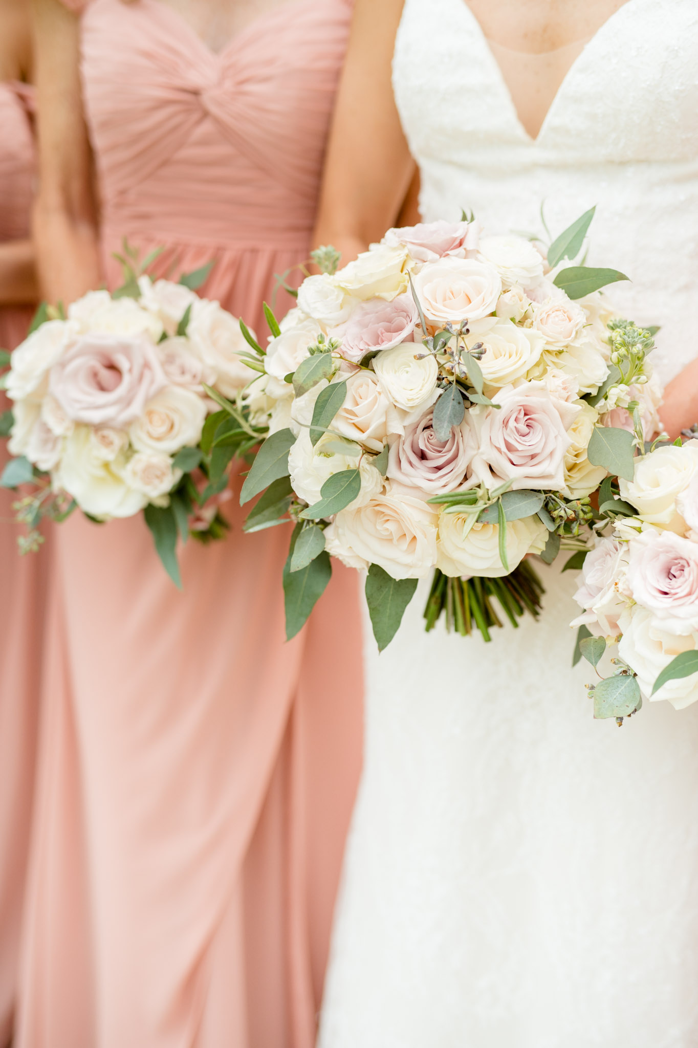 Closeup of bride and bridesmaid's flowers.