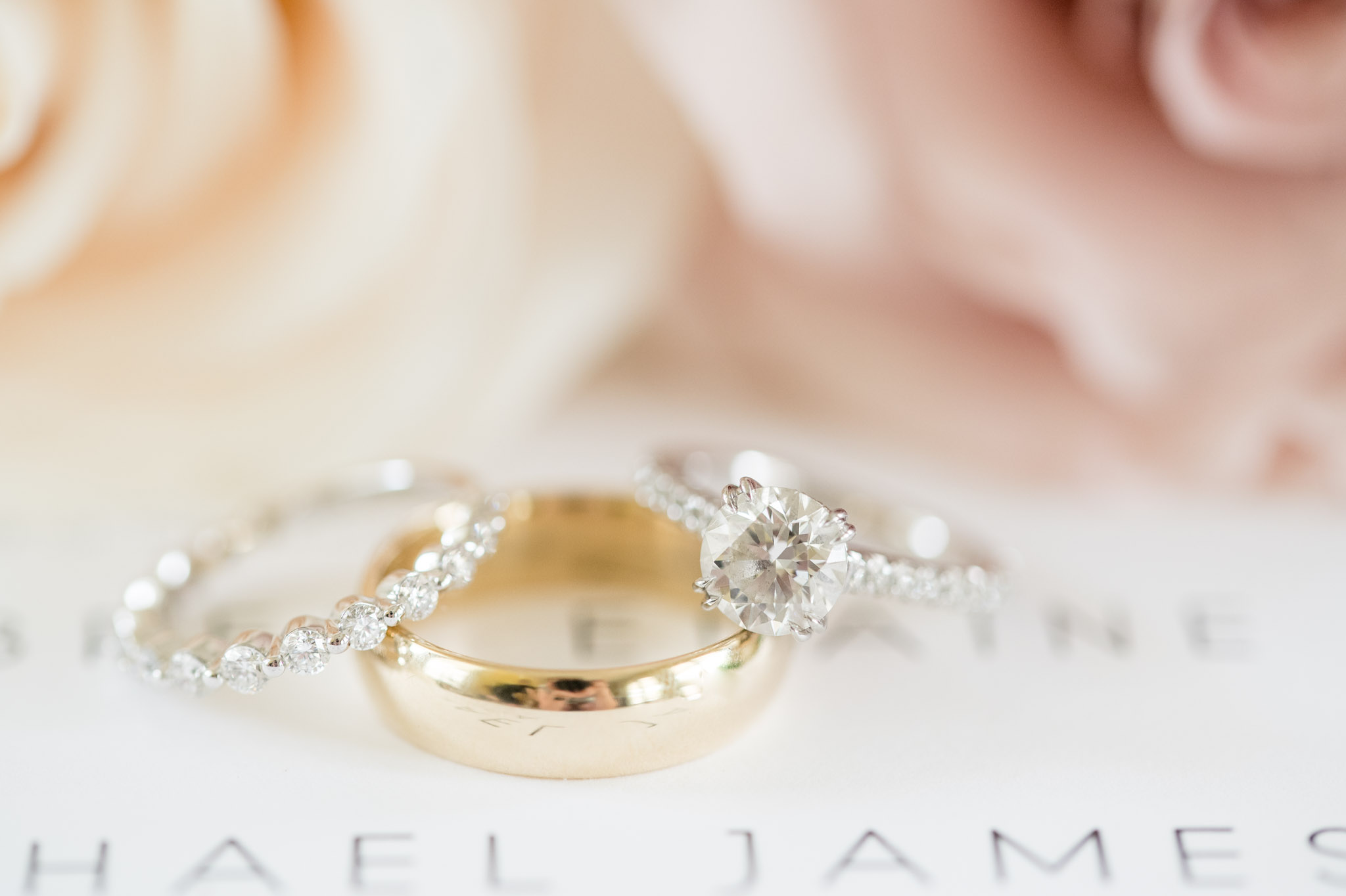 Closeup of wedding and engagement rings.